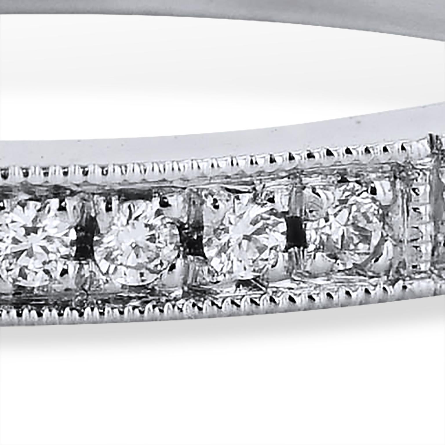 0.19 Carat Round Diamond Pave Platinum Eternity Band Ring Handmade by H&H Jewels

This handmade band ring features 0.19 carat of round diamonds (G/H/VS) pave-set on a platinum band. This ring provides a mosaic of light and color that twinkles with