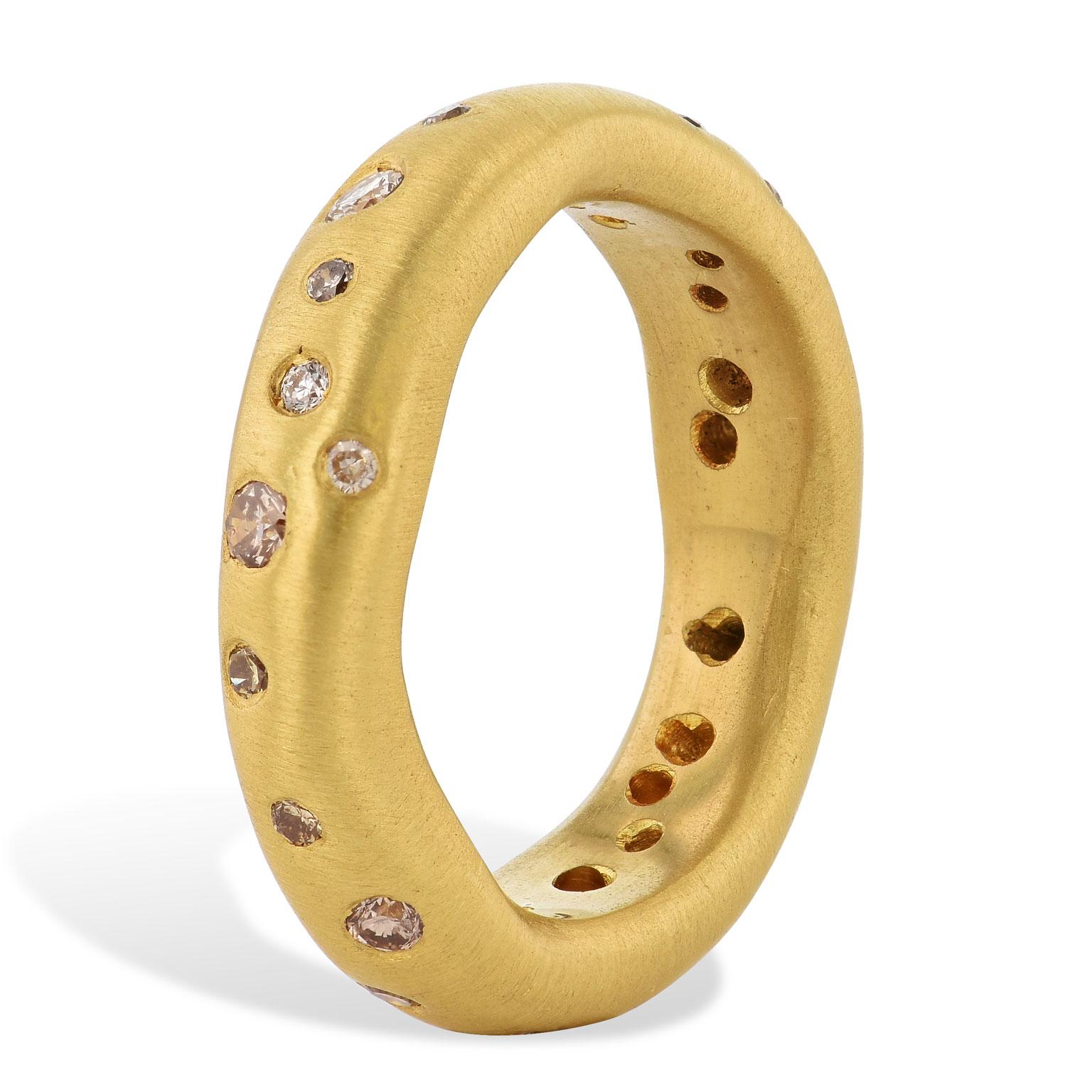 This handmade oblong-shaped 22 karat brushed yellow gold band ring features 0.32 carat of diamond in flush setting. With a non-traditional shape and construction, this band ring reflects a raw yet stylized design.