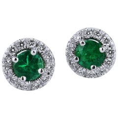 H 
H 0.34 Carat Emerald Stud Earrings