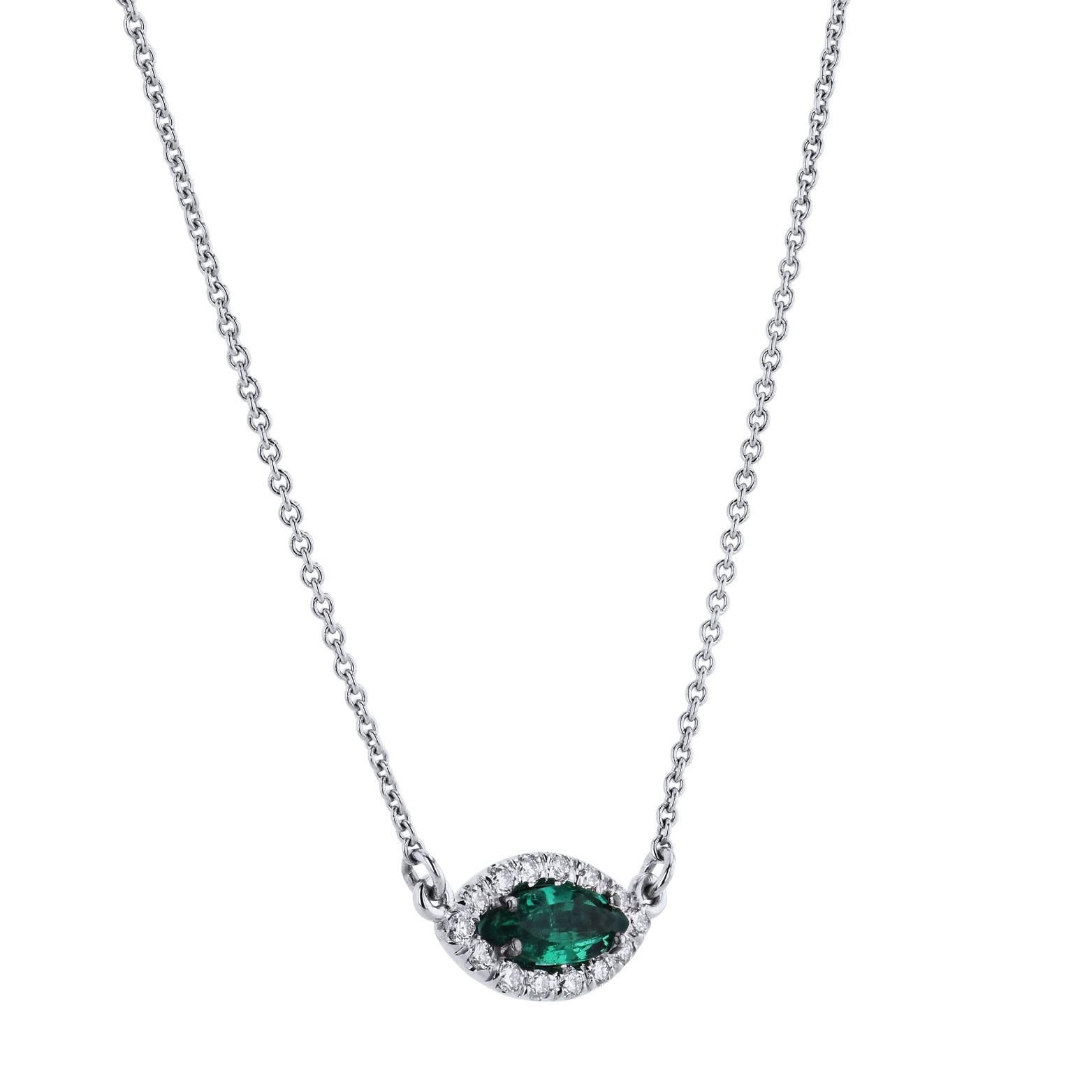 0.15 carat of pave-set diamond (G/H/SI1), affixed in 18 karat white gold, come together to form the outline for this striking handmade pendant necklace. A 0.42 carat marquise cut Zambian emerald is set at center- enrapturing one's gaze in this 18