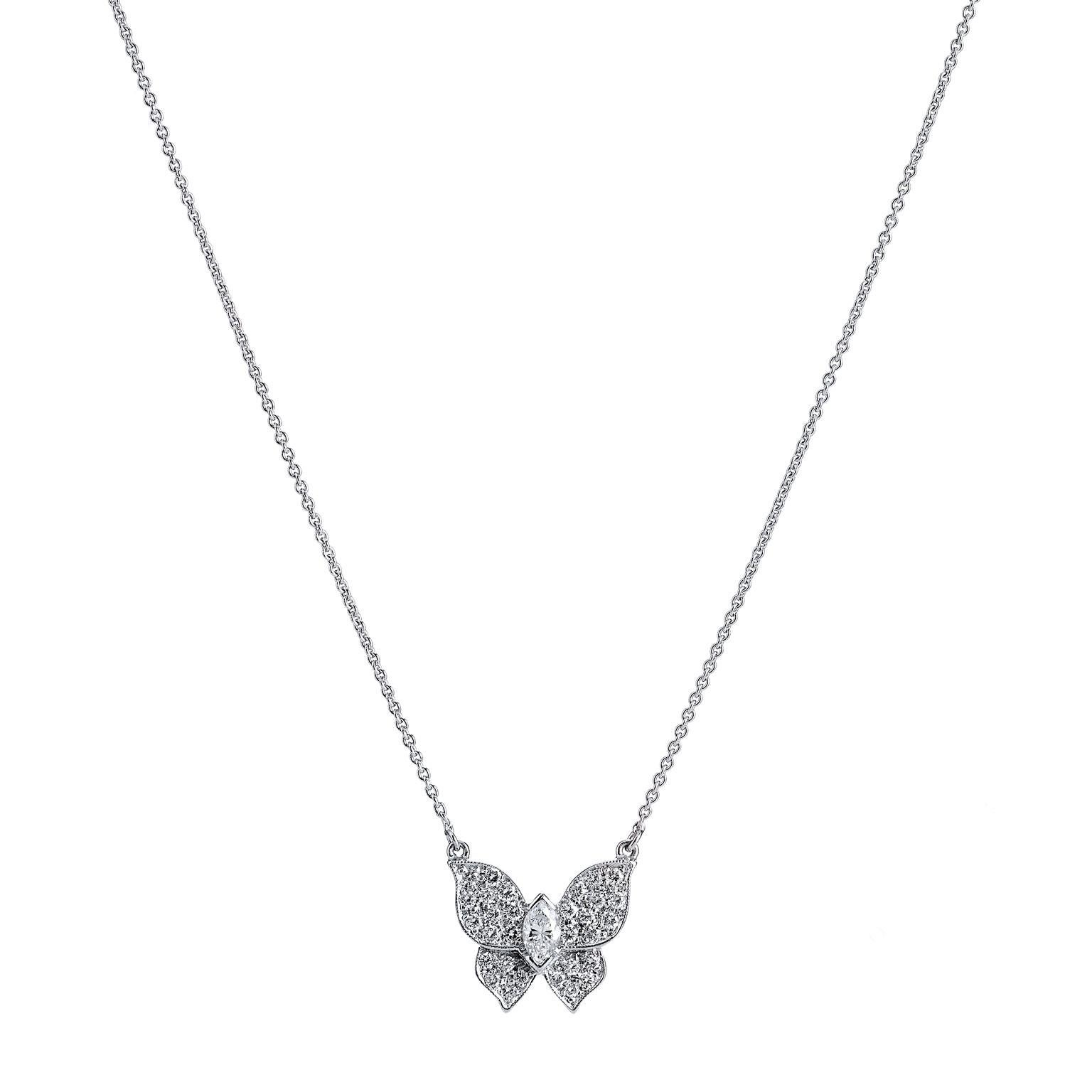 0.54 carat of diamond light shimmers with the movement of a flutter in this handmade H and H butterfly pendant fashioned in 18 karat white gold. This piece features a 0.21 carat prong-set marquis cut diamond at center (H/SI2) accompanied by thirty