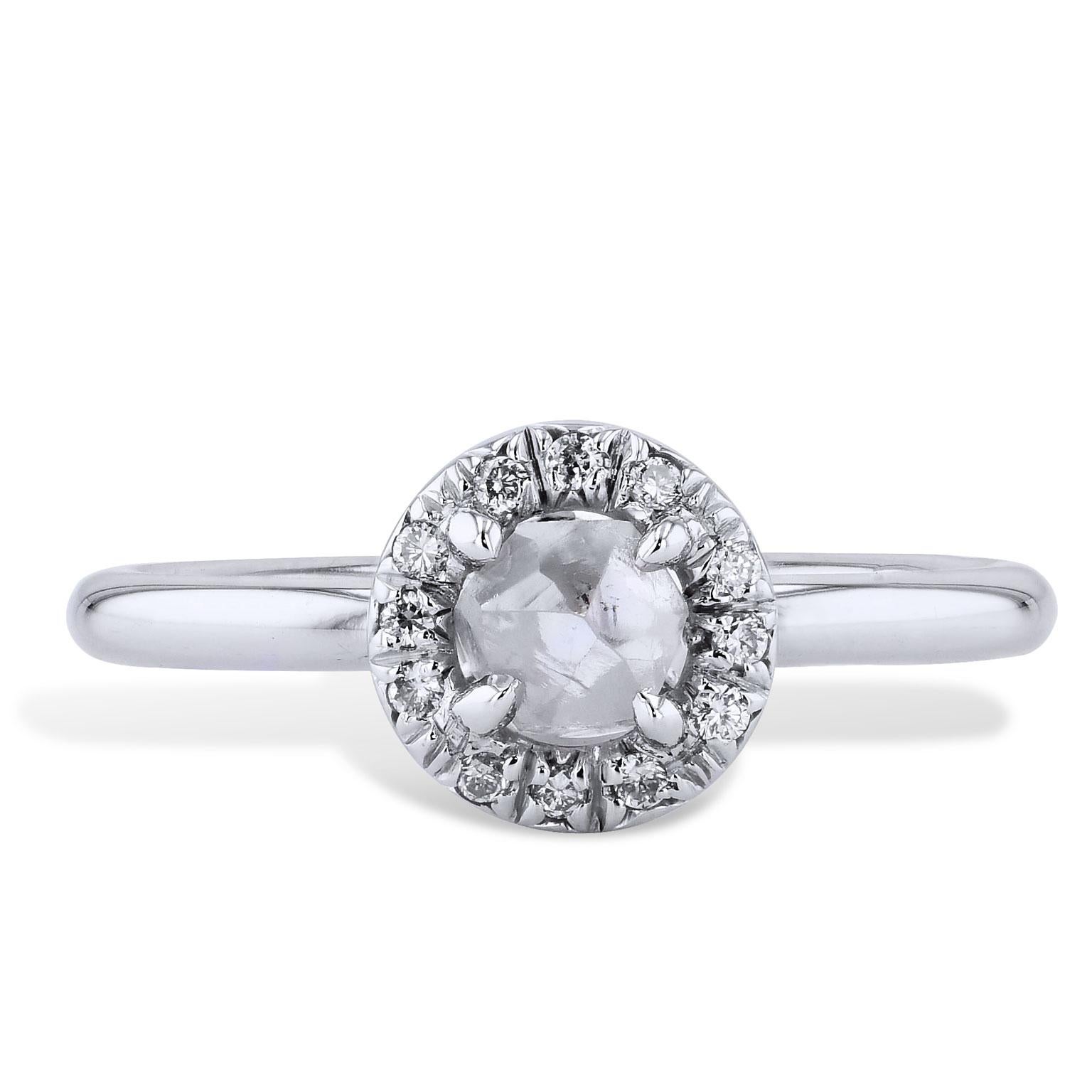 Handmade by H&H 0.64 Carat Natural Rough Diamond 18 karat white gold and Palladium Engagement Ring

Be astounded by the beauty of this 0.64 carat natural rough diamond, featuring 0.08 carats of pave diamonds (H/I/SI) encircled around the center in