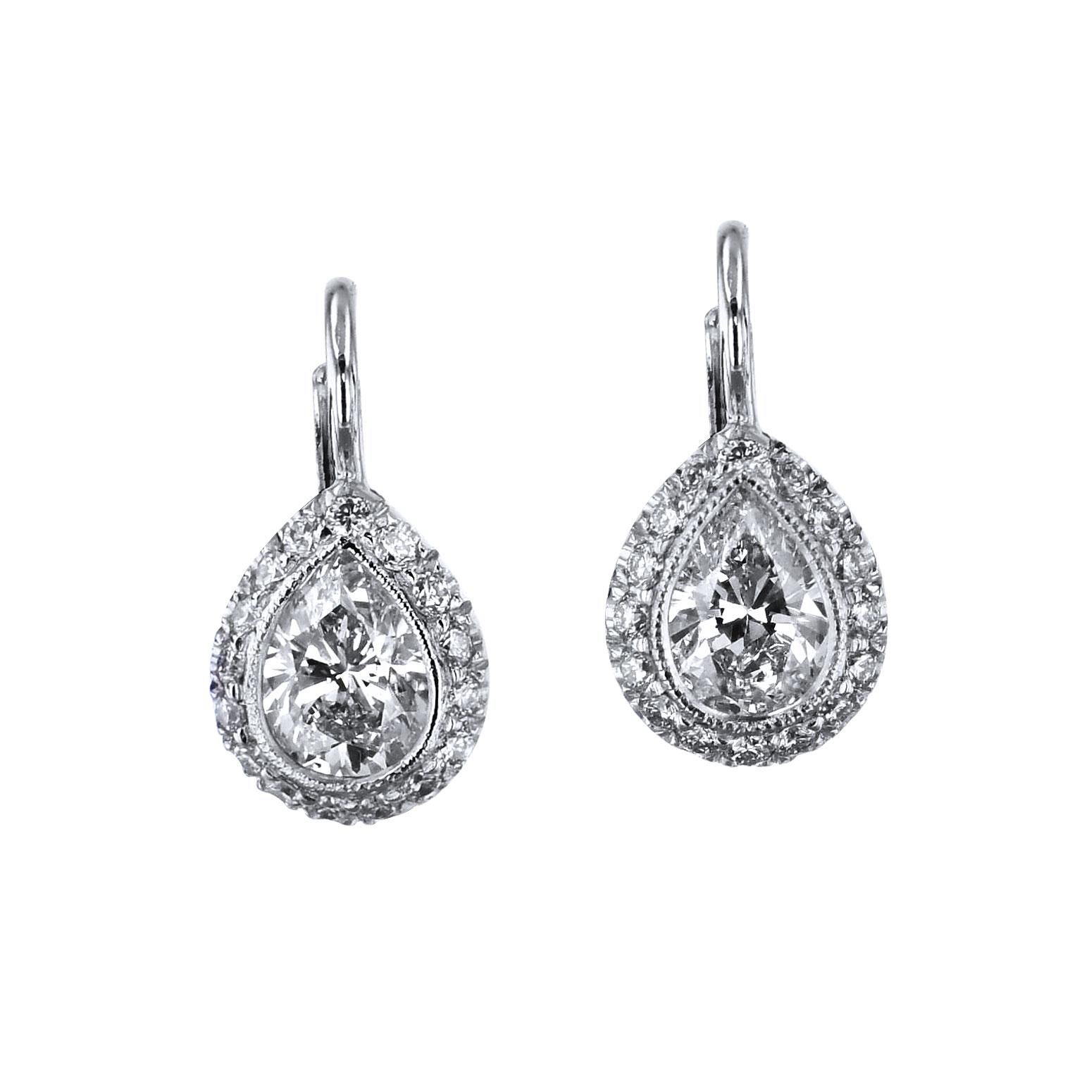 1.06 Carat Pear Shaped and Pave Set Diamonds in 18 kt Gold Lever-Back Earrings

The fabulous earrings are one of a kind and handmade by H&H Jewels.  

They feature two pear-shaped diamonds, with a total weight of 0.85 carat (I/J/SI1), with an
