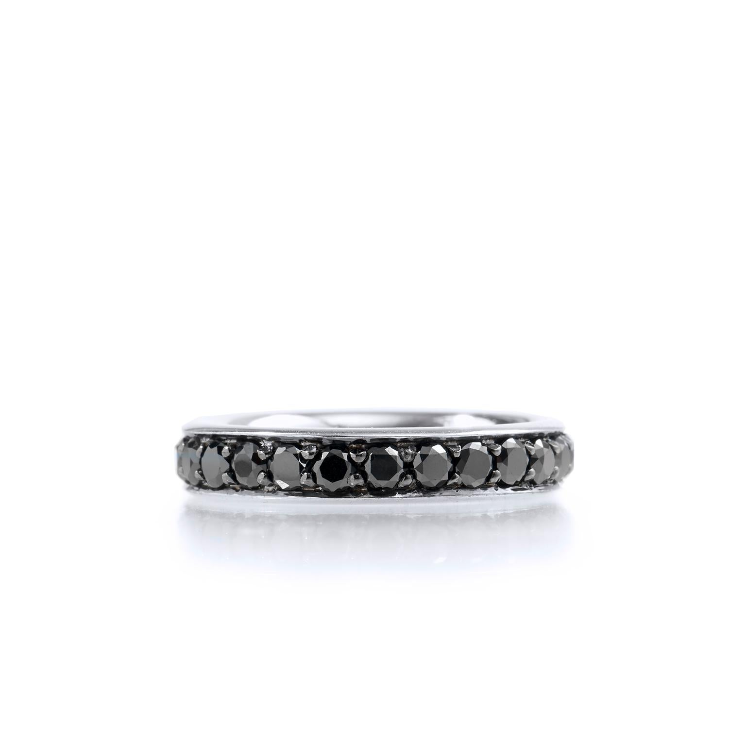 H&H 1.65 Carat Black Diamond Band Ring

18 karat white palladium cinctures 1.65 carat of pave-set black diamonds in this handmade band ring. 
Affixed to a 4 millimeter 18 karat palladium, this band ring has a modern edge and appeal. 