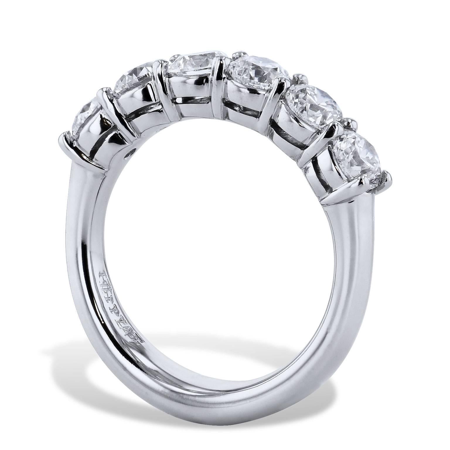 This handmade H & H band ring features 1.80 carat of round brilliant cut diamond in shared-prong (E/F/VS1/VS2). Fashioned in platinum, this band ring provides a mosaic of light and color that twinkles with remarkable beauty.

size 6 