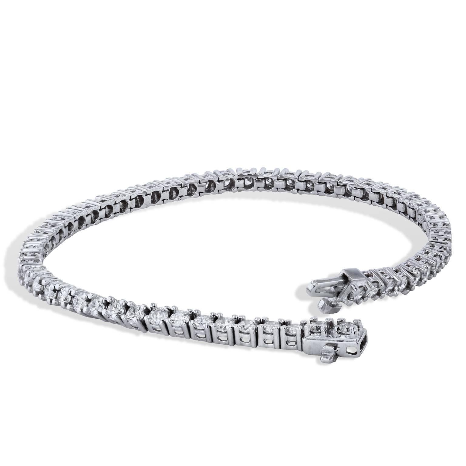 4.06 Carat Diamond Tennis Bracelet Set in 18 karat White Gold  

This tennis bracelet features fifty-eight diamonds, with a total weight of 4.06 carat (D/E/SI1/SI2).  Each diamond is set in a four prong setting and it's all made in 18 karat white