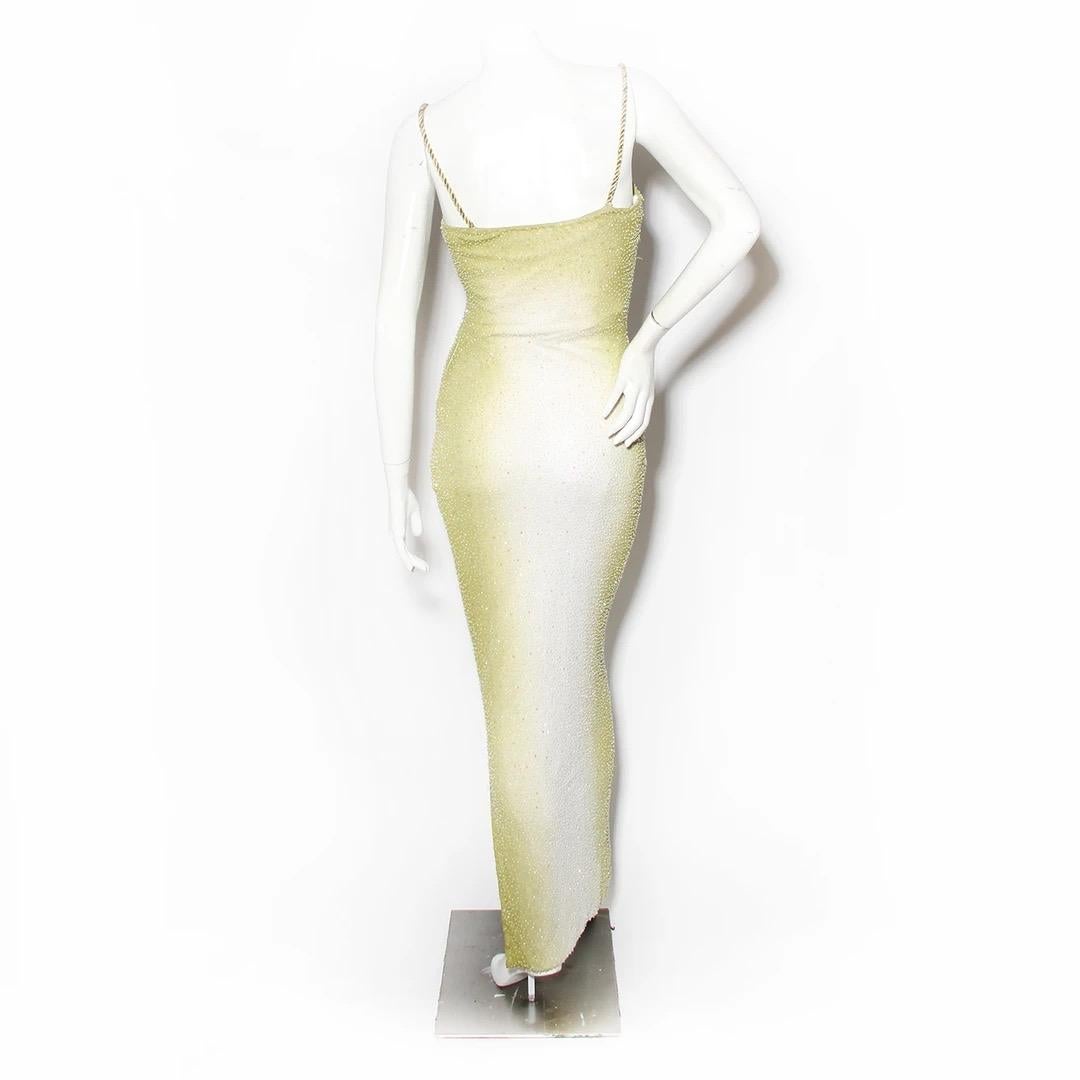 H Halston by Kevan Hall Evening Gown
Spring / Summer 1998 
Lime green and white ombré 
Bead and sequin detailing 
Column style dress
Twisted gold rope straps 
Slit at bottom of gown 
Invisible zipper on left side of dress 
Synthetic blended fabric