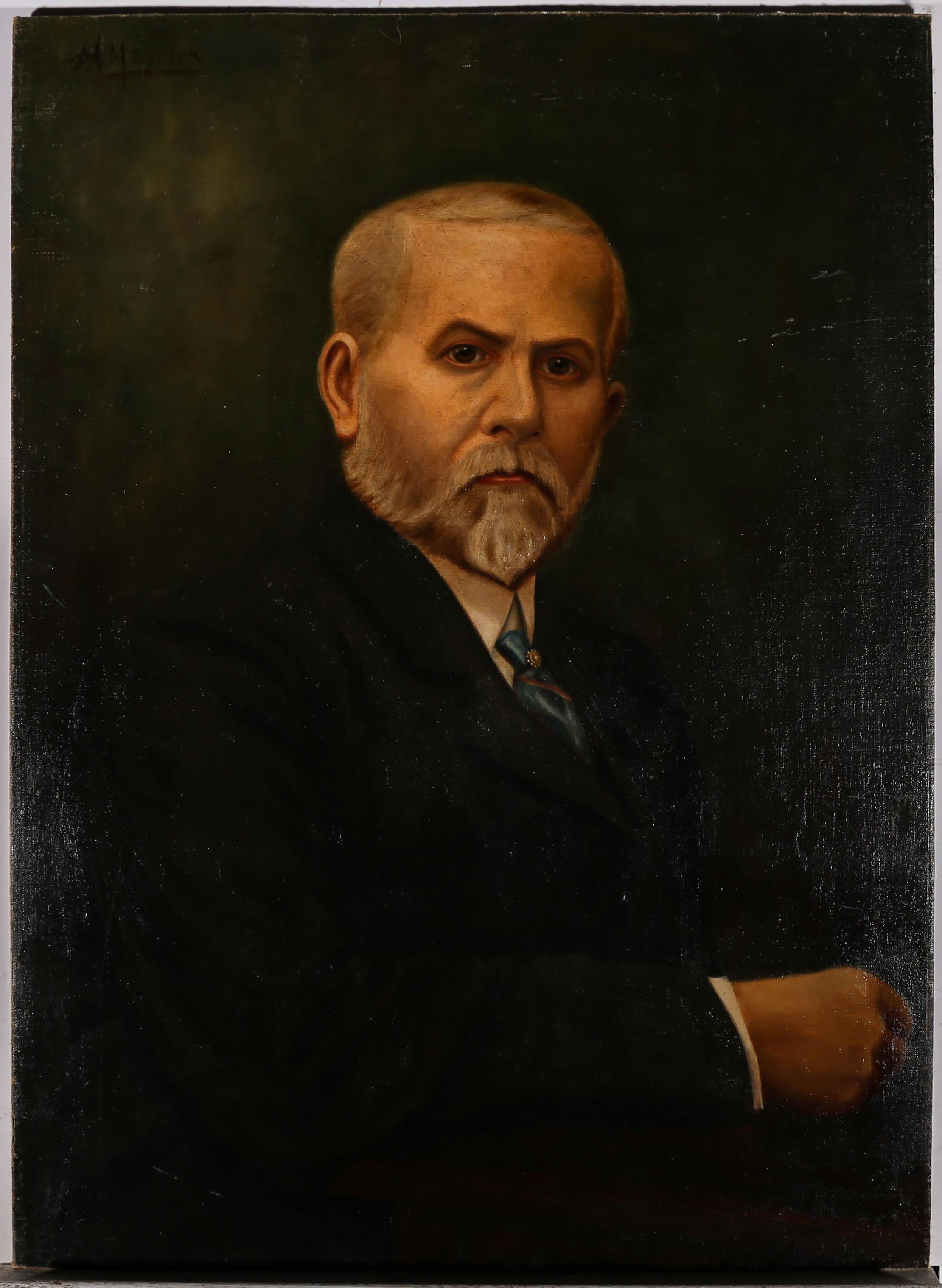 A striking early 20th Century portrait of a regal gentleman with an engaging stare. He is smartly dressed in a black suit and white shirt with a jeweled tie pin in his blue and red tie. He holds himself with importance and gravitas. The artist has