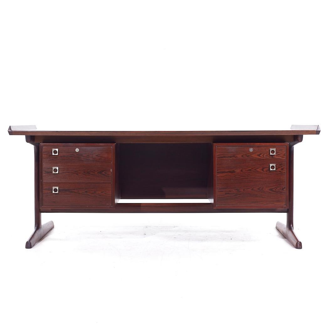 H P Hansen Mid Century Danish Rosewood Floating Executive Desk

This desk measures: 74.25 wide x 37.25 deep x 28.25 high, with a chair clearance of 27 inches
The flair detail adds 1.25 inches to the height

All pieces of furniture can be had in what