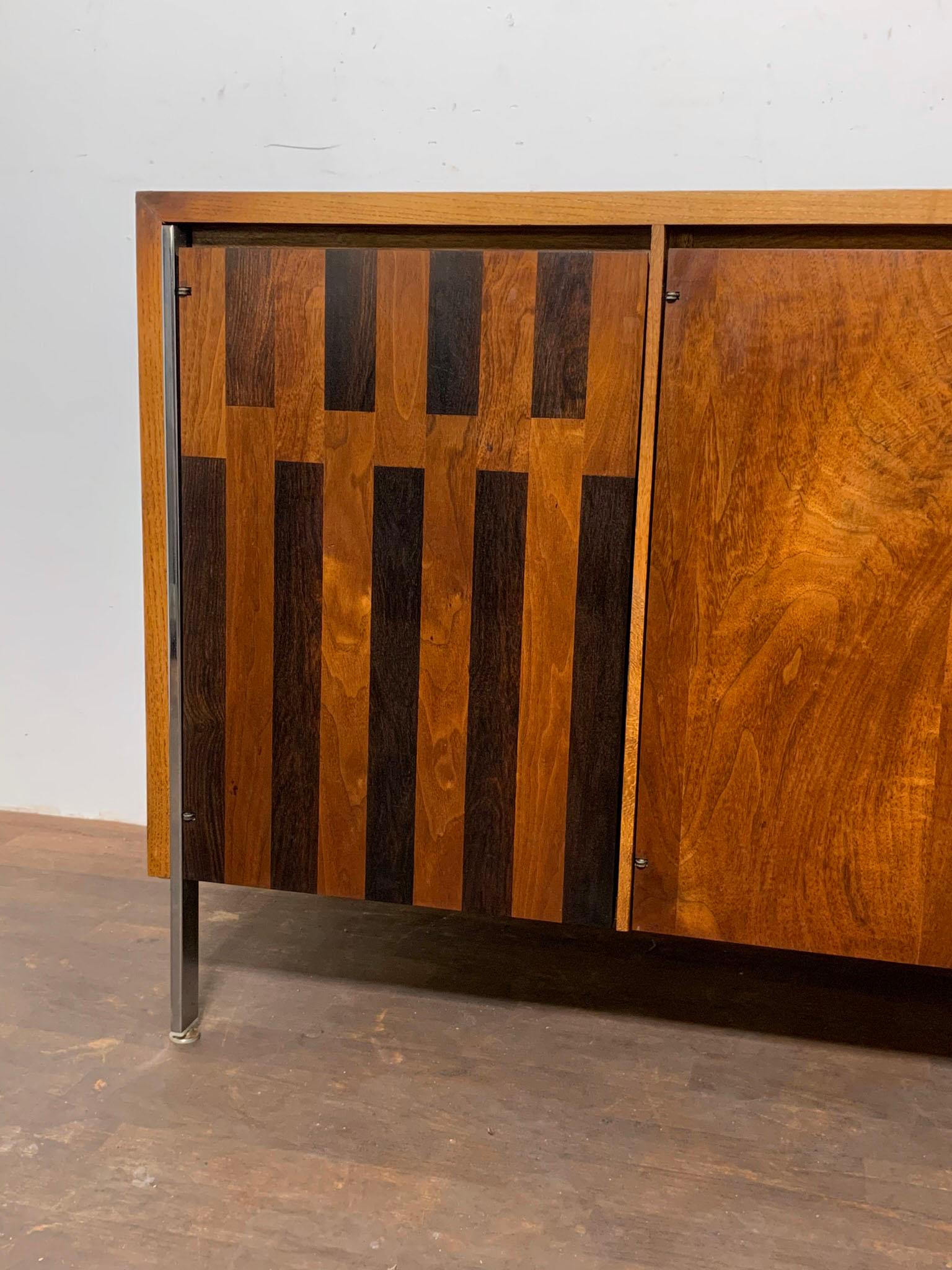 A walnut and rosewood inlay credenza designed by H. Paul Browning for Stanley Furniture, ca. 1960s.