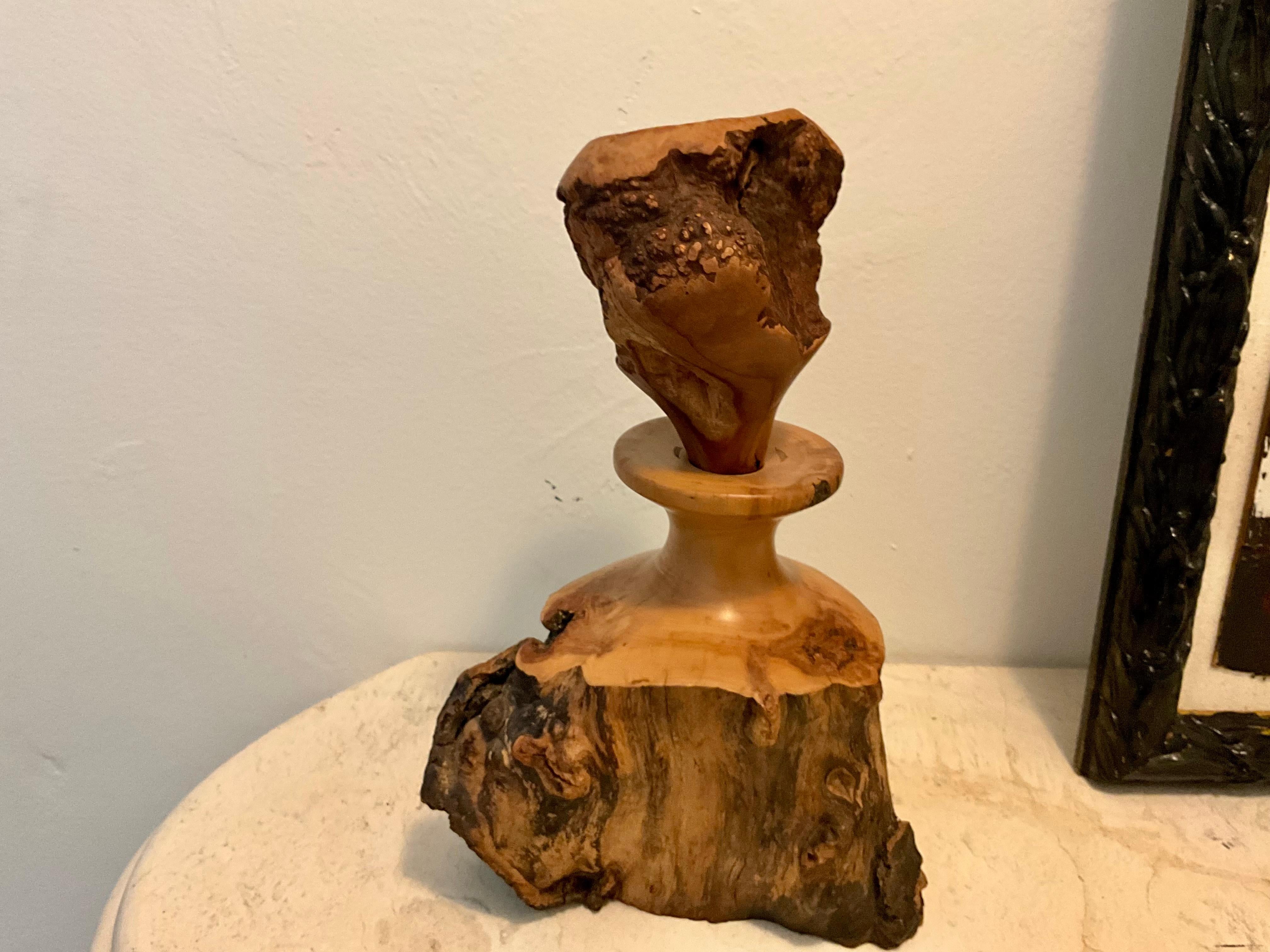 H. Quarles 1991 Signed Mountain Laurel Burl Wood Freeform Live Edge Bottle Sculpture with Large Stopper

This unique bottle sculpture by H. Quarles, dated 1991, is crafted from mountain laurel, a dense hardwood known for its natural burl formations.
