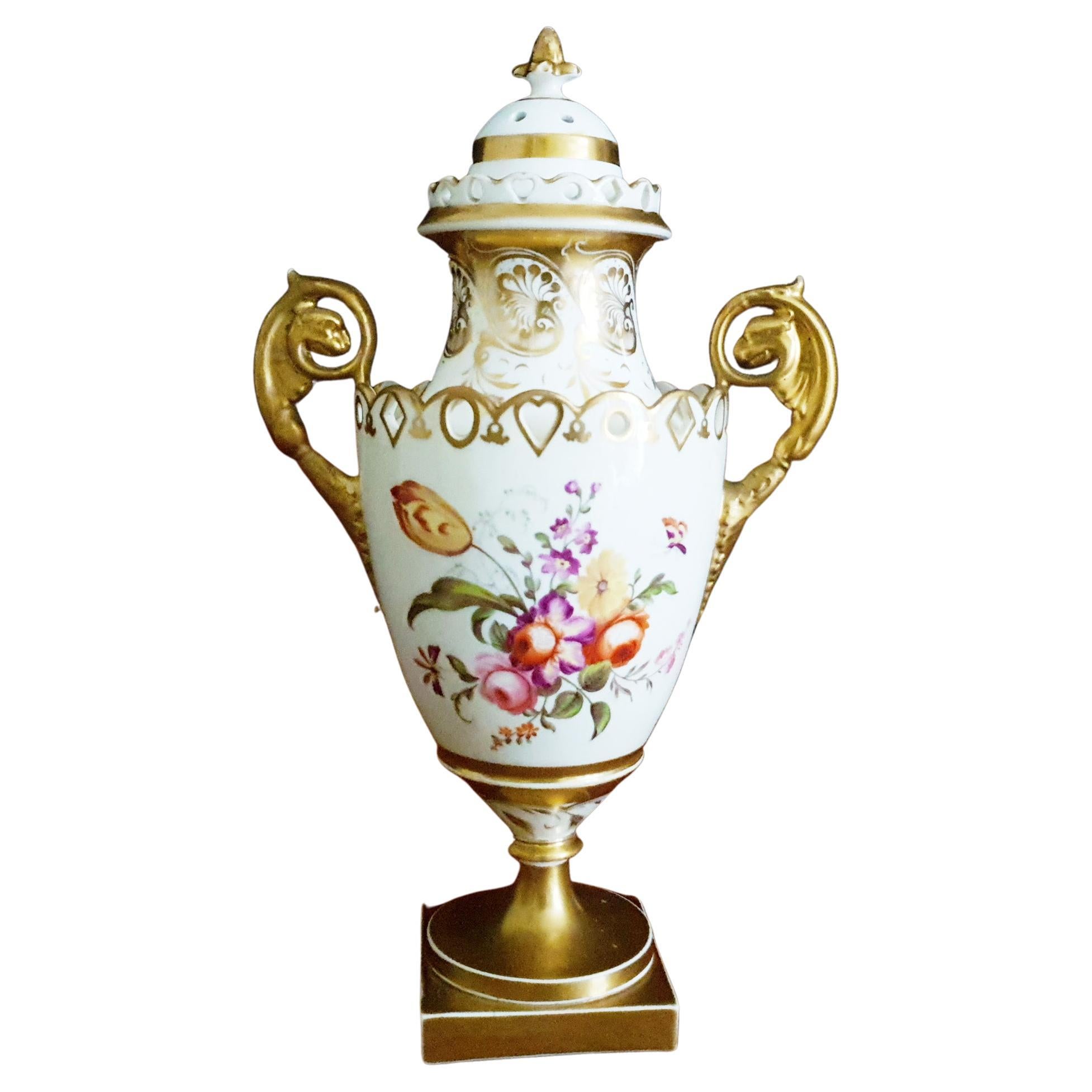 A beautiful H & R Daniel 18th century single handpainted Pot Pourri vase complete with cover and decorated with an exotic bird in a landscape enclosed with an arched trellis with trailing summer flowers. The main body of the vase rises up to meet
