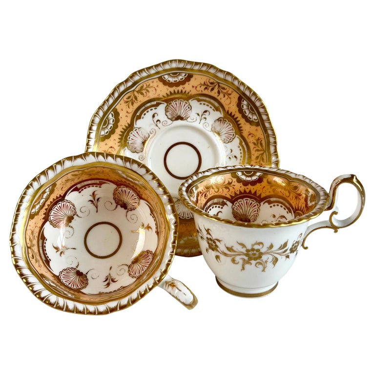 H and R Daniel Porcelain Teacup Trio, Peach and Gilt Shells, Regency ca ...