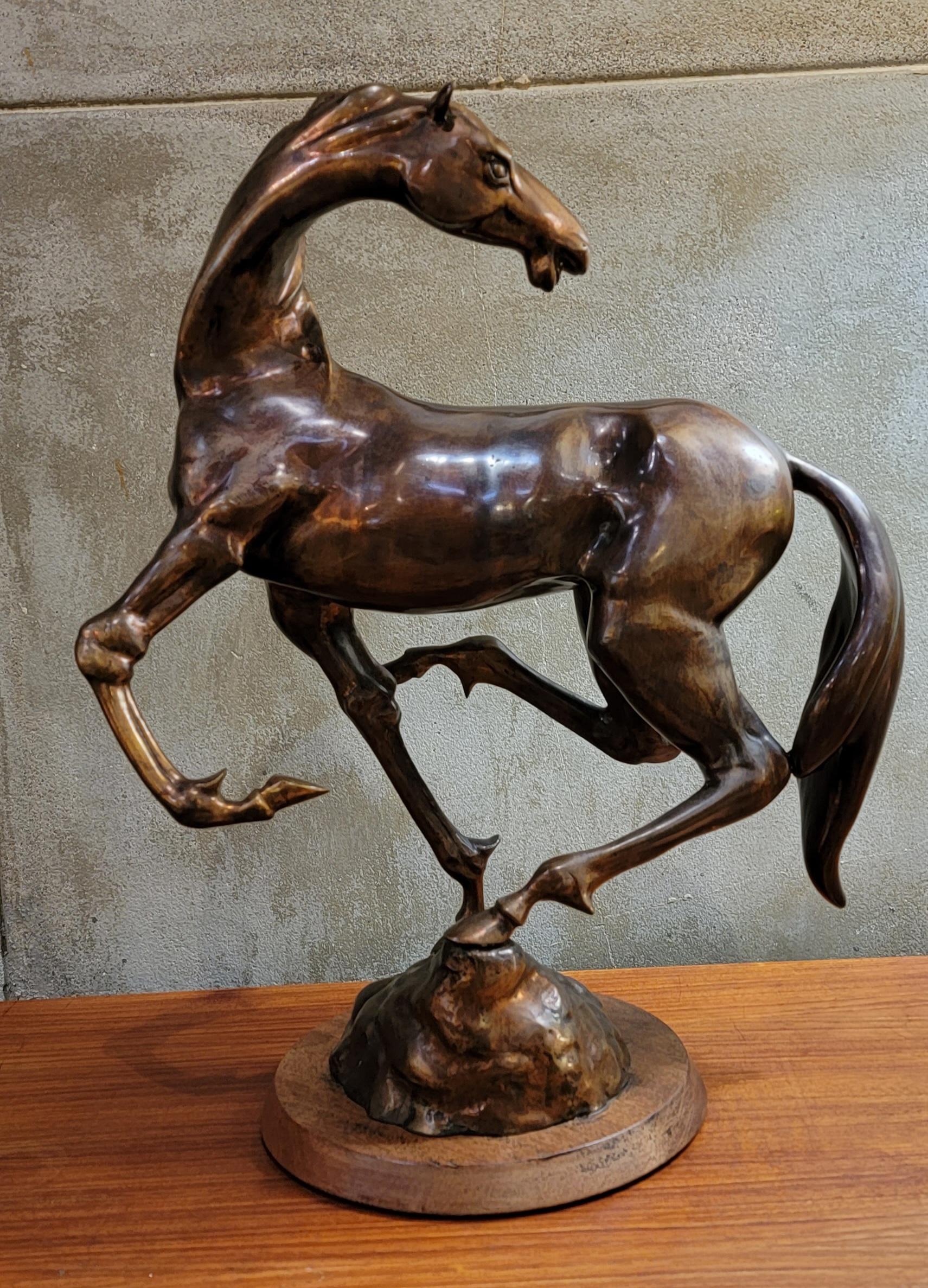 Rearing horse bronze sculpture by Hattakitkosol Somchai. Measures 21.13