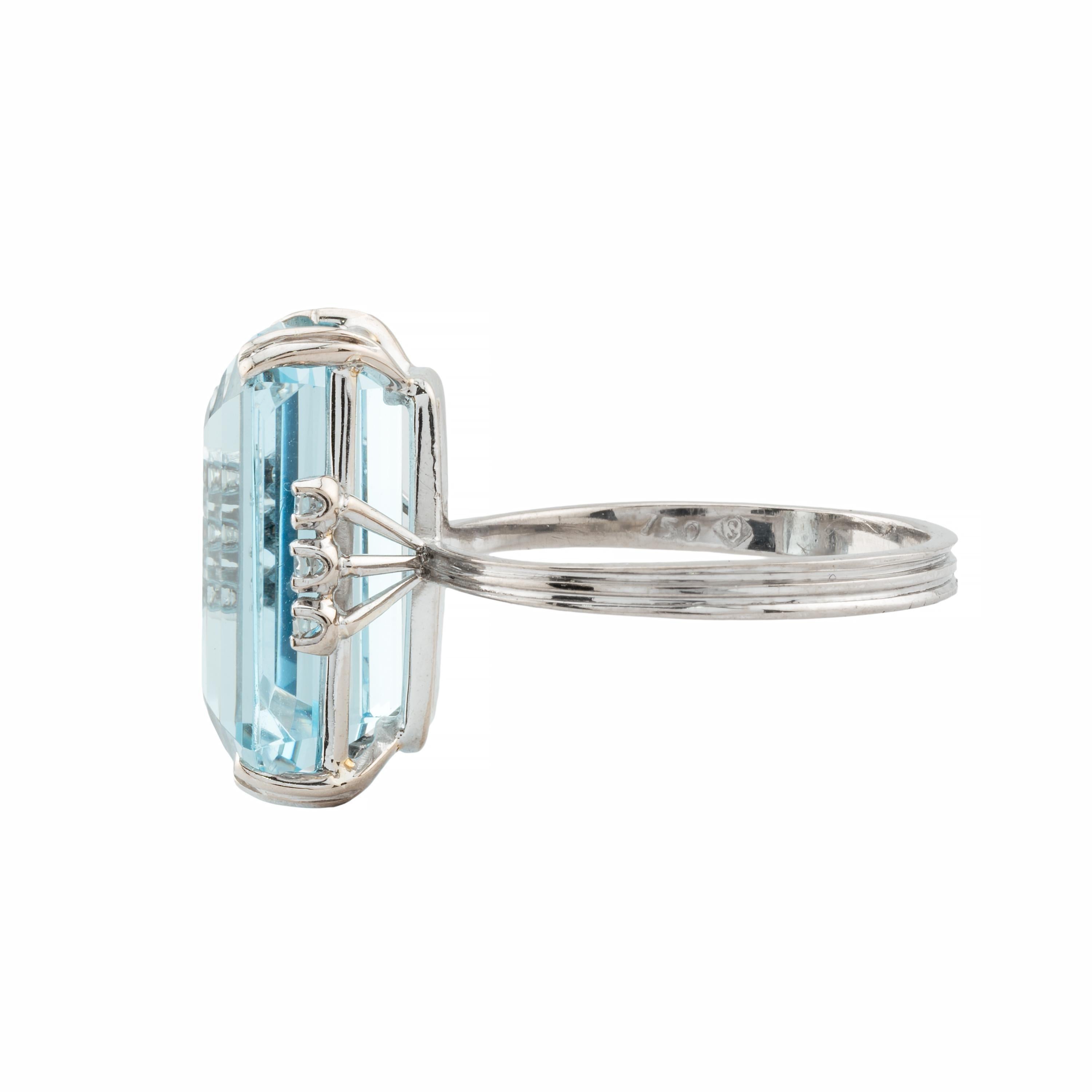 Aston Estate Jewelry Presents:

A vintage H Stern aquamarine and diamond ring in 18 karat white gold.  Centered by a gorgeous sky blue 11.70 carat emerald cut Brazilian aquamarine. Accented by six prong set round cut diamonds of a combined 0.12