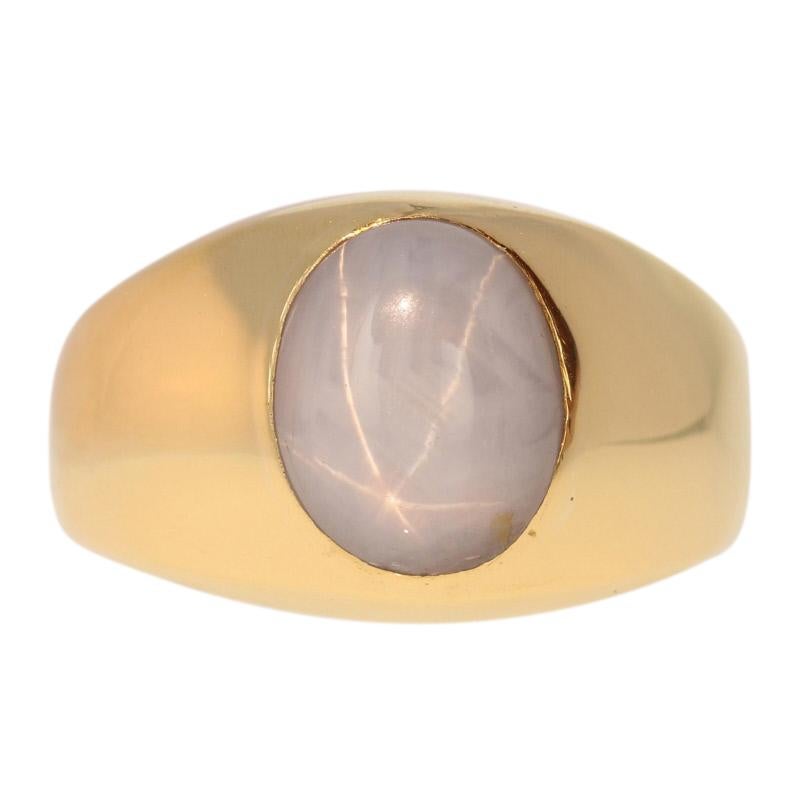 Well-dressed and ready to impress! Crafted by H. Stern, this handsome signet ring showcases a star sapphire cabochon set in glowing 18k yellow gold. 

This ring is a size 9 1/2 - 9 3/4, but it can be re-sized up 1/2 a size for a $30 fee. Once a ring