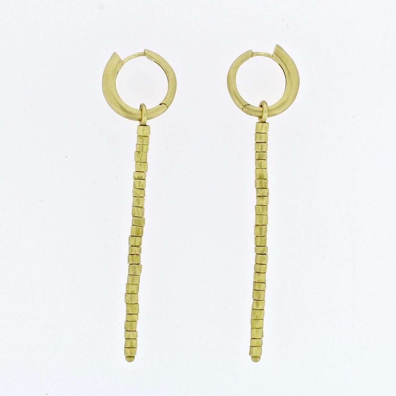 A fine pair of 18-karat 'Golden Beads' hoop and tassel earrings by H Stern.

Elegant in their reduced form and matte gold finish.

Marked to the hoop with the HS maker's mark and the Israeli harp hallmark for .750 fineness.

Length: just under 3