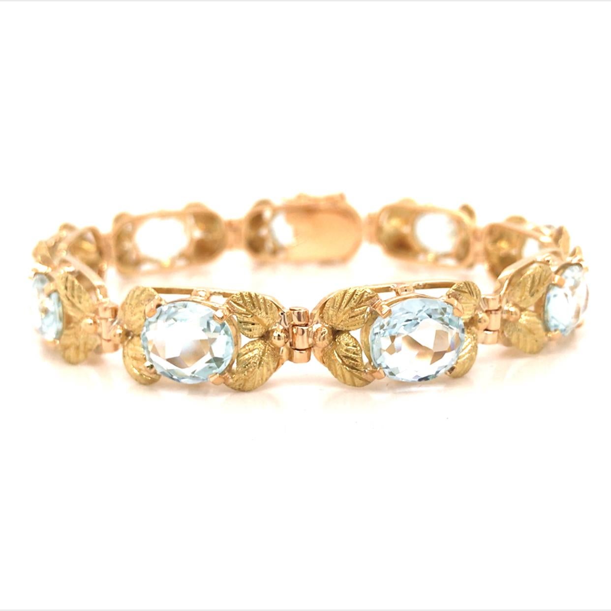 H Stern Aqua Link Bracelet in 18K Yellow Gold.  (9) Aqua Gemstones weighing approximately 19 carat total weight are expertly set in engraved links.  The Bracelet measures 7 1/2 inch in length and 3/8 inch in width.  23.9 grams.  Stamps (S) 750.