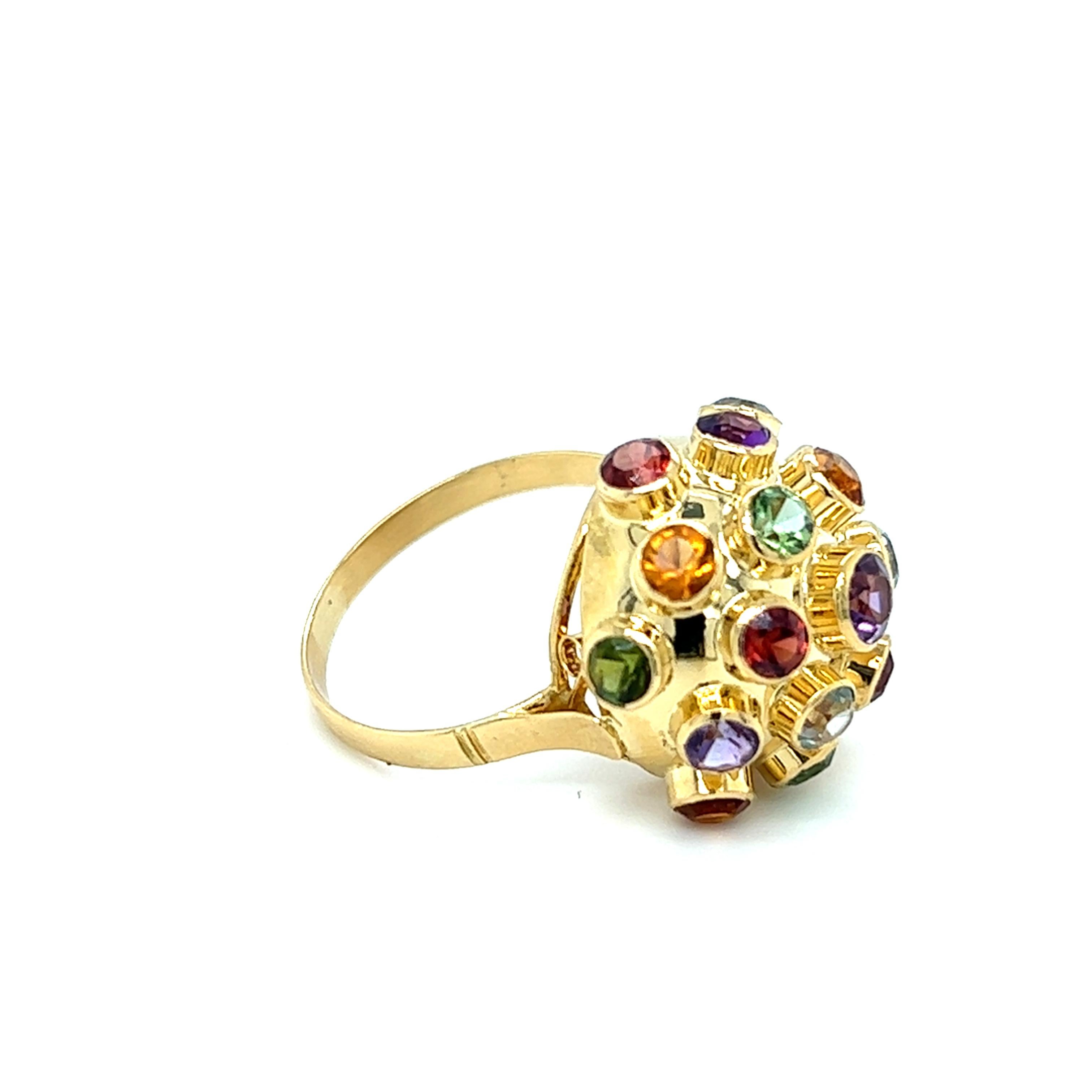 One 18-karat yellow gold Sputnik design dome ring by Brazilian designer H. Stern, set with nineteen (19) 3.5mm bezel set round gemstones.  The ring contains four (4) amethyst,  four (4) peridot,  three (3) citrine,  three (3) aquamarine, and five