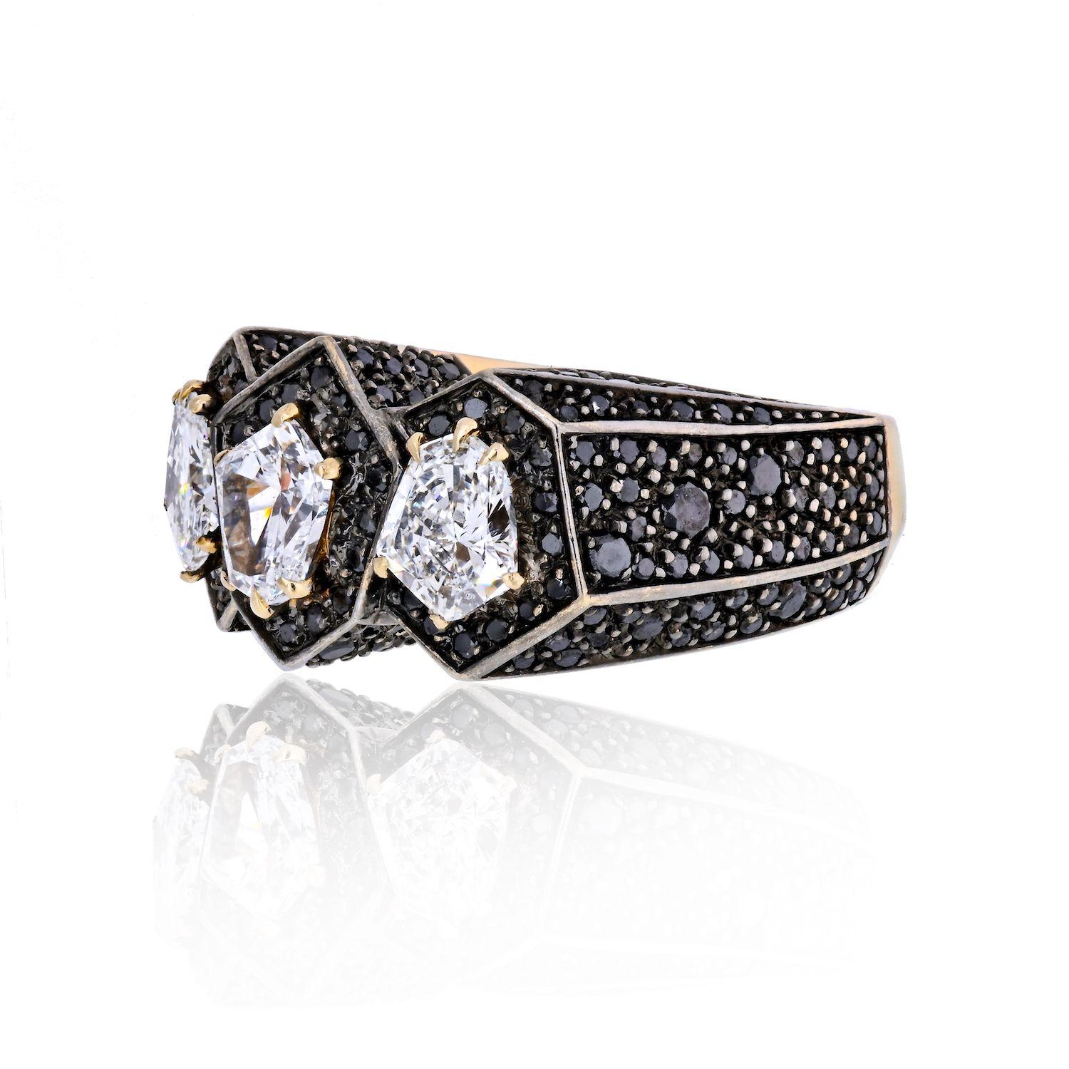 Stunning Novelty three stone white diamond and black diamond accented ring by H. Stern. This estate ring featuring 3 white diamonds with total weight of 2.06 cts - 0.61 ct E VS1, 0.66 F I1, and 0.79 ct D VS1 . Also 2.75 cts of black diamond rounds.
