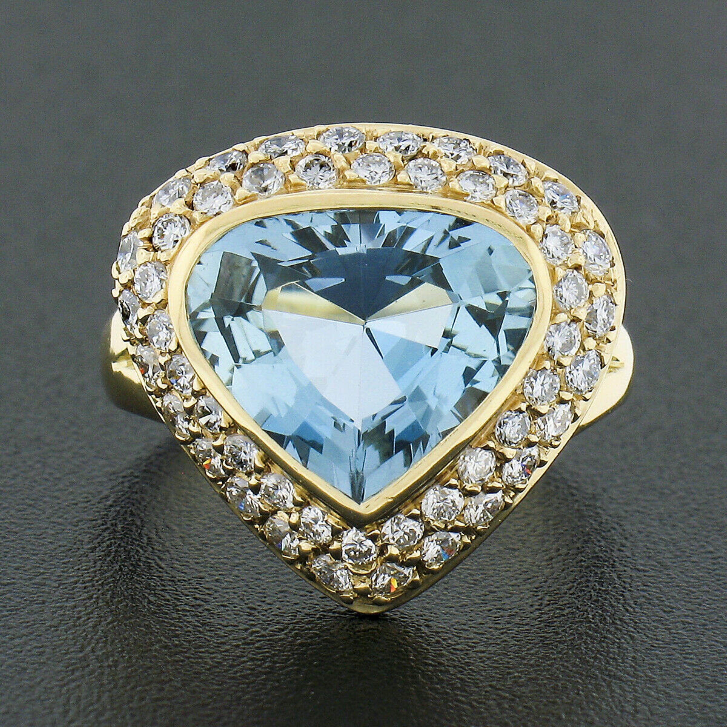 Here we have a magnificent cocktail ring that is crafted from solid 18k yellow gold by H.Stern. It features a stunning aquamarine solitaire with a unique modified Wide Pear shape neatly bezel set at the center, weighing approximately 2.90 carats.