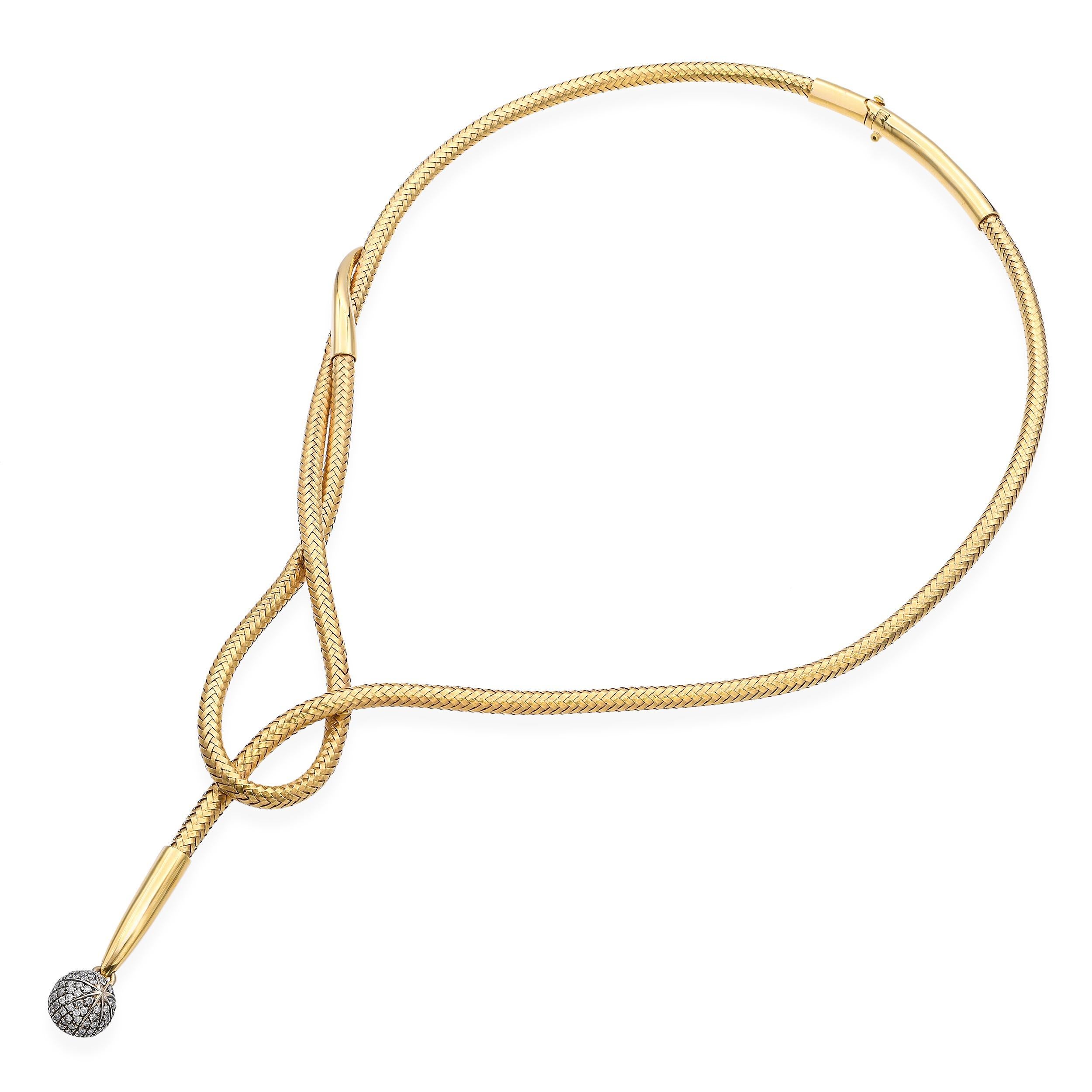 From H. Stern’s iconic Copernicus collection, this 18k yellow gold necklace features a richly woven gold collar that embodies timeless Brazilian craftsmanship. At its center, a delicate pavé diamond sphere dangles gracefully—evoking celestial
