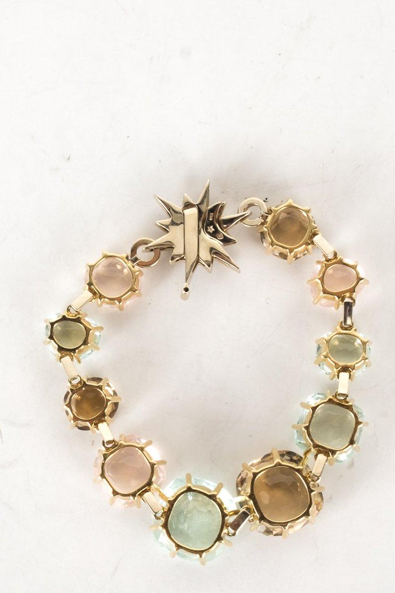 H. stern 18k yellow gold metallic Moonlight bracelet with multicolored faceted gemstone fixed bracelet, Noble star closure featuring pavé set round brilliant cut diamond, and push-lock closure with safety bar. From the Moonlight collection.
 
Metal