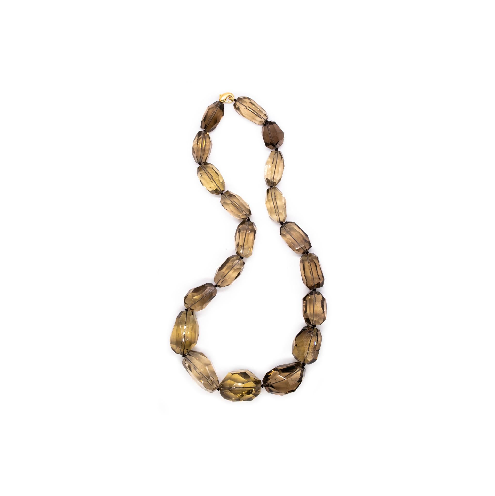 An statement necklace designed by H. Stern.

Very modern and massive piece designed by the Brazilian jewelry house of H. Stern. Is composed by 19  oversized faceted beads of natural Brazilian Greenish-Smokey quartz and suited with a 18 karats yellow