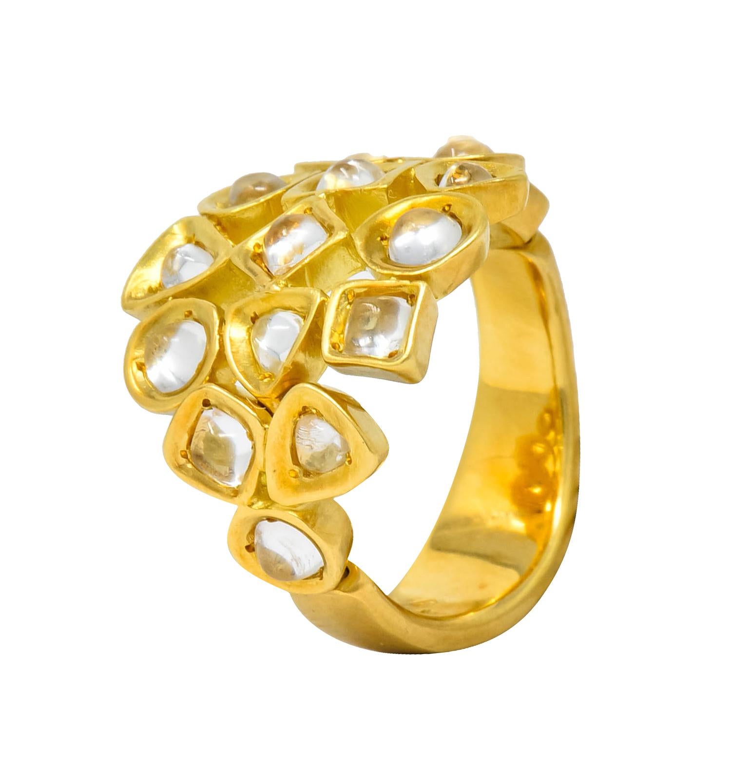 Designed as interlocking, concave, geometric shapes, each centering a small cabochon rock crystal

Satin finished with top of ring articulating with mesh-like movement

Maker's mark for H. Stern and stamped 750 for 18 karat gold

Circa 1970's

Ring