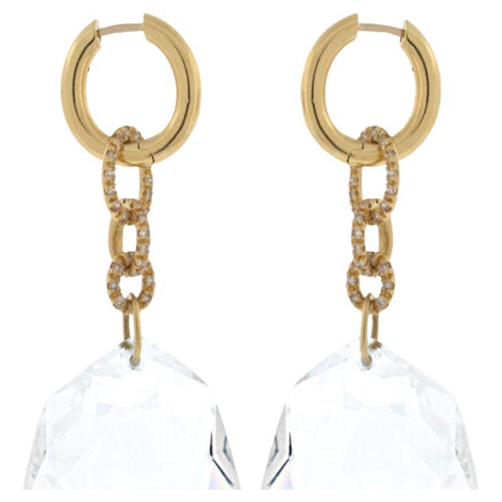 From the limited edition Diane Von Furstenberg for H.Stern this pair of asymetrical large faceted rock crystals are suspended beneath pave (G-H/ VS-SI) diamond links. The earrings can be worn with or without the rock crystal. Handmade in 18k yellow