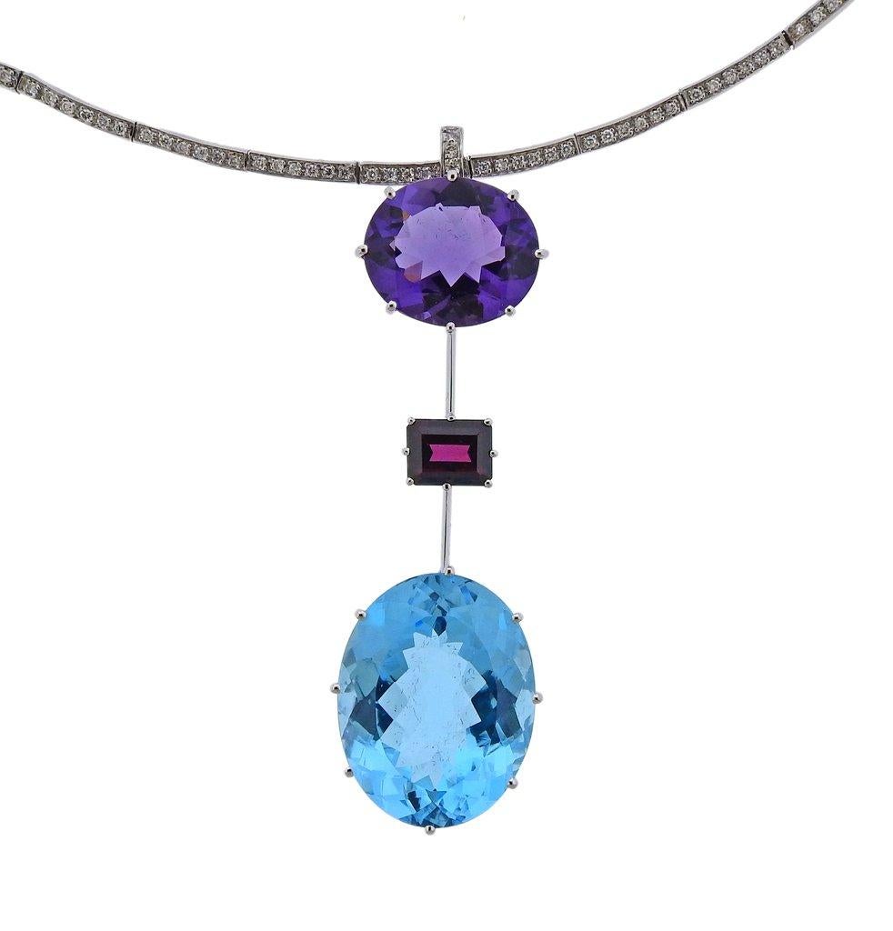 18k white gold collar necklace by H. Stern with long drop pendant, adorned with approx. 0.6ctw in G/VS diamonds, 18mm x 15mm amethyst, 25mm x 20mm x 21mm blue topaz and 9mm x 7mm pink tourmaline. Necklace is 16 1/4