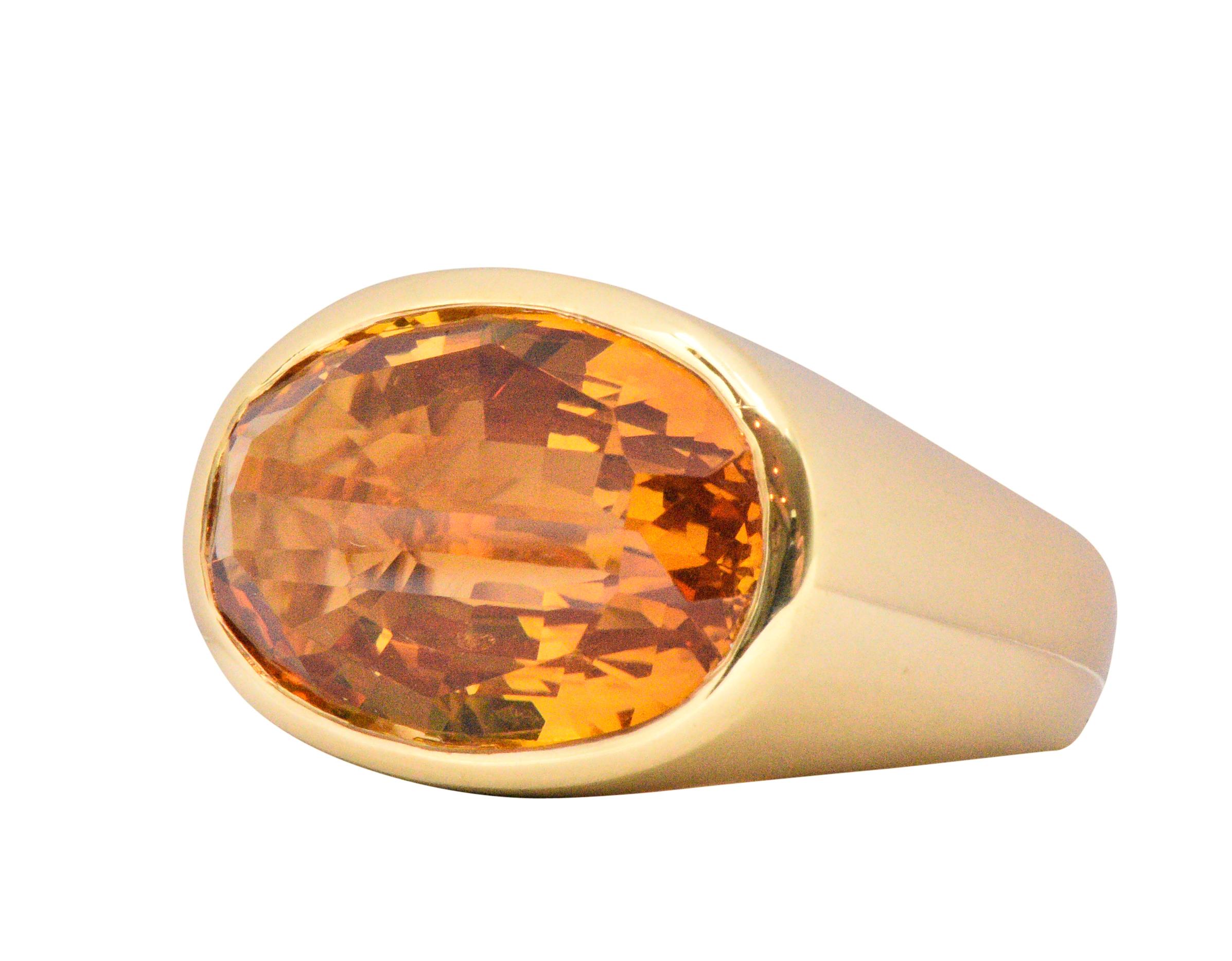 Centering an mixed rose cut citrine measuring approximately 19.9 x 15.5 x 9.0 mm, bright rich very slightly yellowish orange

The citrine is bezel set in polished gold

Fun and unique cut citrine making this a very special ring

With maker's mark