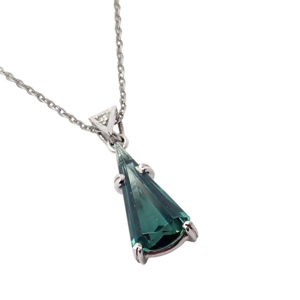 18k White Gold Diamond Blue Green Tourmaline Pendant Necklace by H. Stern. 
With 1 round brilliant cut white diamonds total weight approximately 0.02ctw
1 fancy pear/triangle shape deep blue/green tourmaline 6mm x 14.5mm
Details: 
Length: