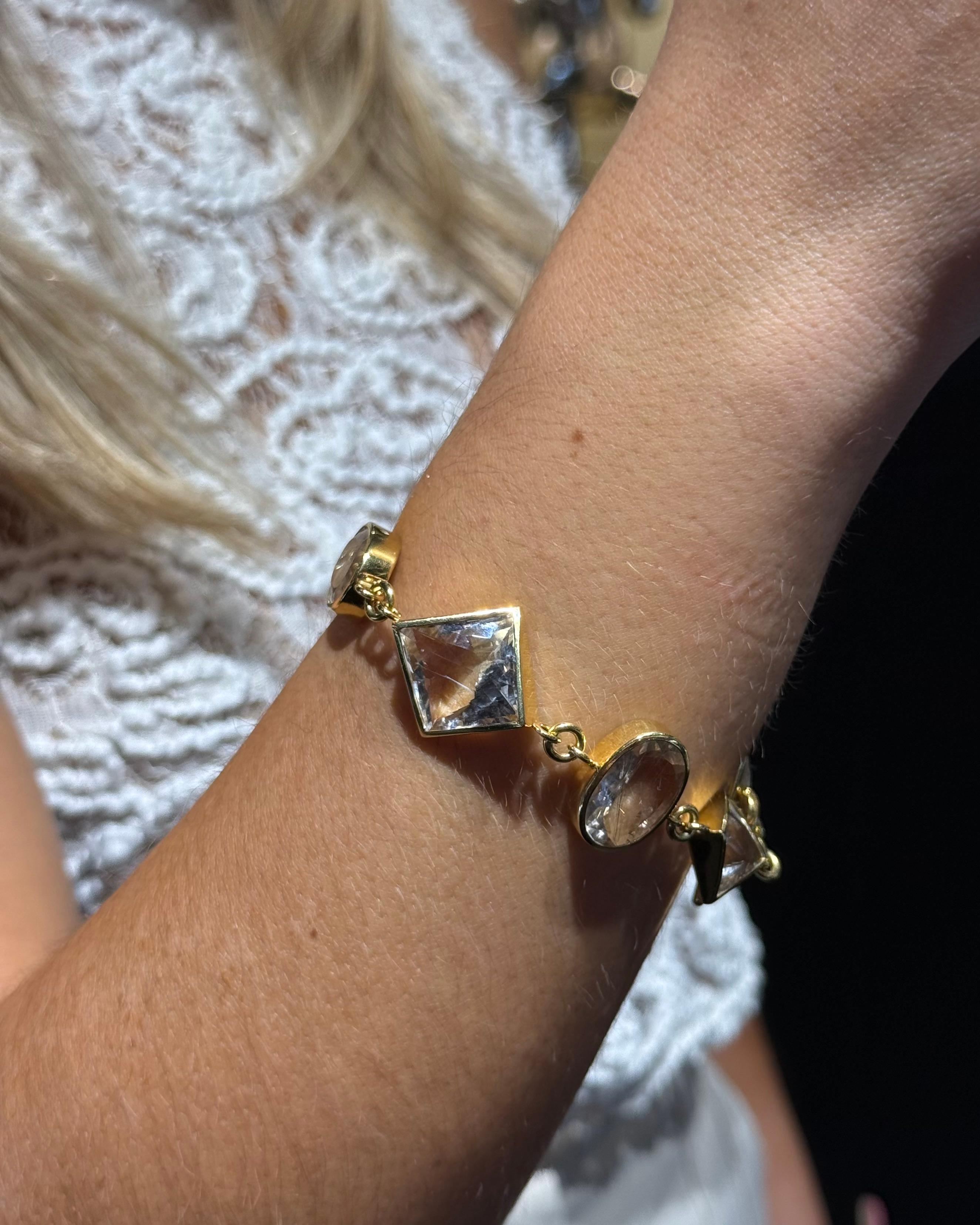 H. Stern (Diane von Furstenberg) Rock Crystal and Rutilated Quartz Bracelet in 18K Yellow Gold. A bold and sculptural bracelet from the iconic DVF for H. Stern collection—a celebrated collaboration between fashion designer Diane von Furstenberg and
