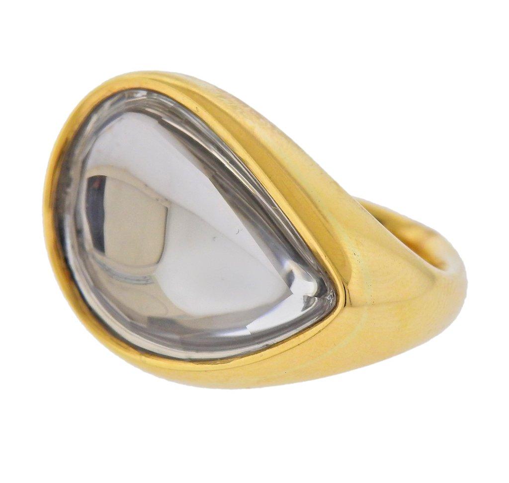 18k yellow gold ring by Diane Von Furstenberg and H. Stern, with center crystal. Ring size - approx. 6, ring top - 20mm x 28mm. Marked - Love Harmony Laughter, Star mark, DVF charm mark, 750. Weight - 20.4 grams. 