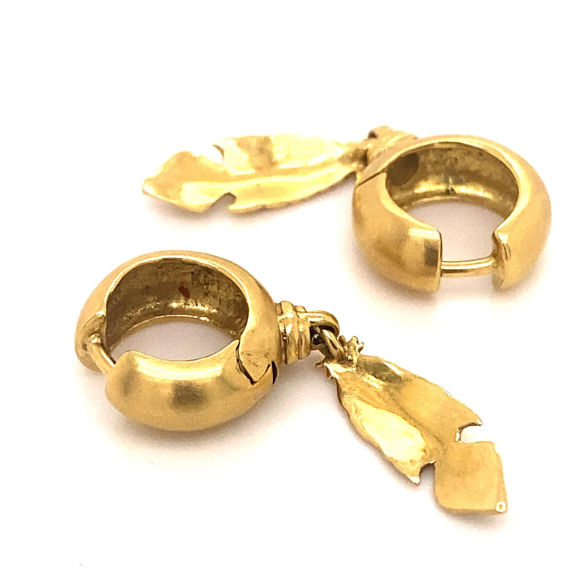 This is a beautiful pair of earrings by H. Stern from the Purangow collection inspired by Amazon tribes.  The earrings have dangling feathers attached to hoops in 18K gold marked 750 S hallmark.  Excellent condition, Weight 4.9 grams, measures 1.25”