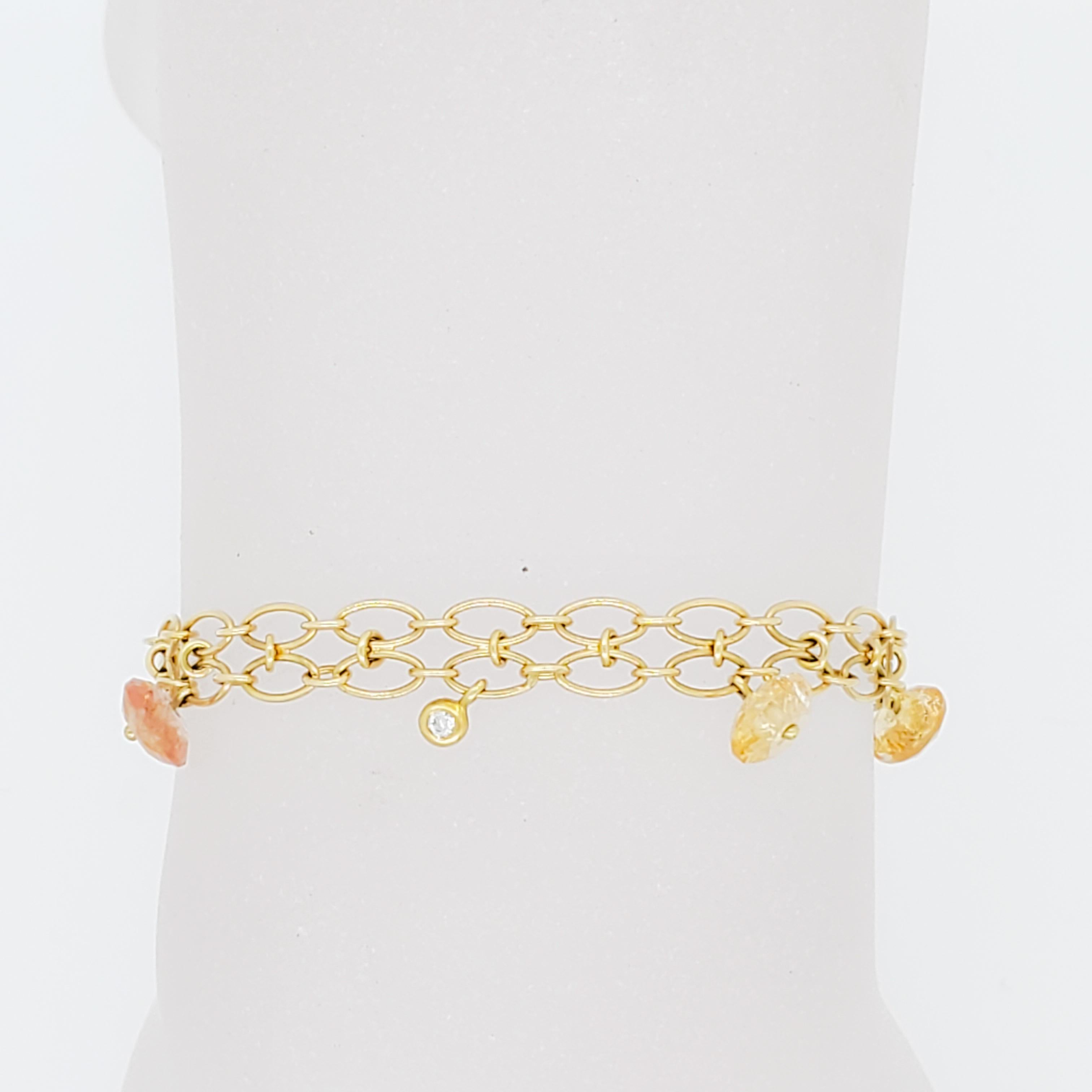Gorgeous H. Stern estate bracelet with flower beads and 0.01 ct. diamond round bezel in the middle.  Handmade in 18k yellow gold.   Length is 5.75