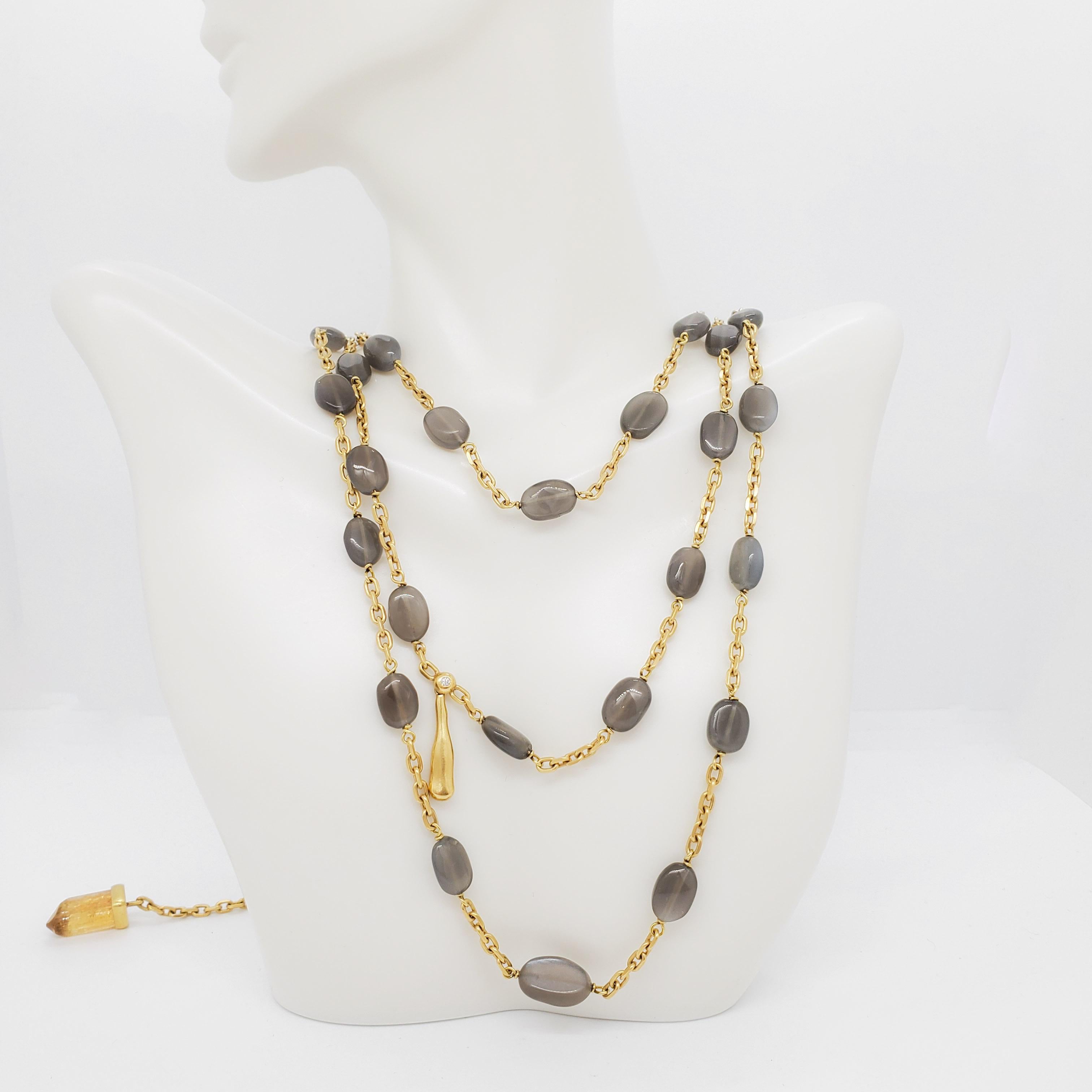 Gorgeous H. Stern estate necklace with 37 gray stone beads and 0.02 ct. white diamond rounds handmade in 18k yellow gold.  