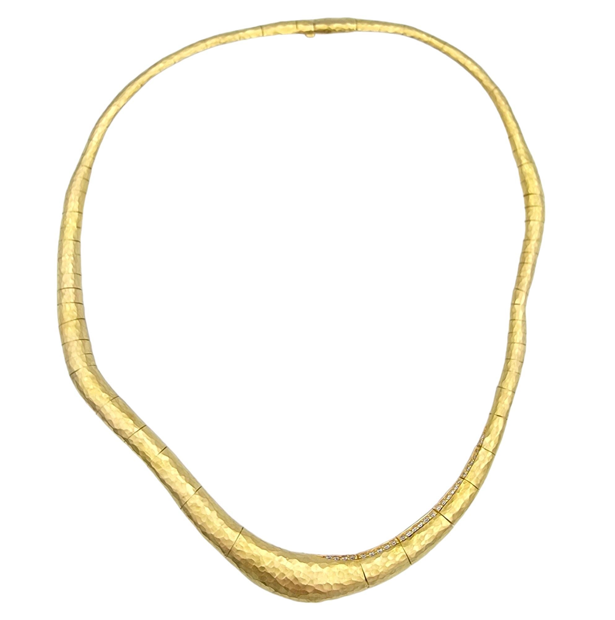 The H. Stern collar necklace, crafted in luxurious 18 karat yellow gold, exudes opulence and sophistication. Its unique design features a string of dazzling diamonds gracefully set along the collar, adding a touch of glamour and elegance to the