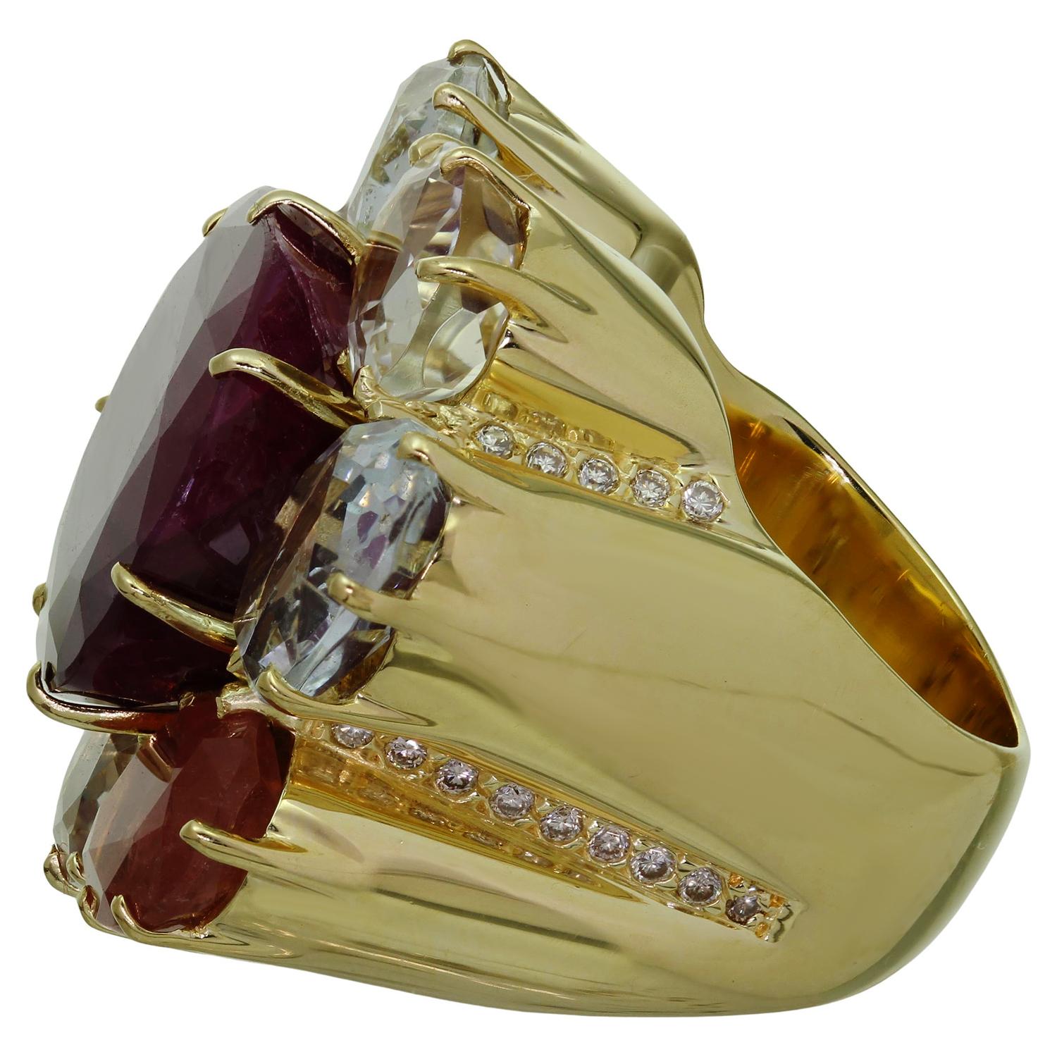 This gorgeous H. Stern ring from the Harmony collection for Diane Von Furstenberg is crafted in 18k yellow gold and set with ruby, tourmaline, aquamarine and citrine gemstones and 36 round brilliant F-G VS1-VS2 diamonds weighing an estimated 0.70