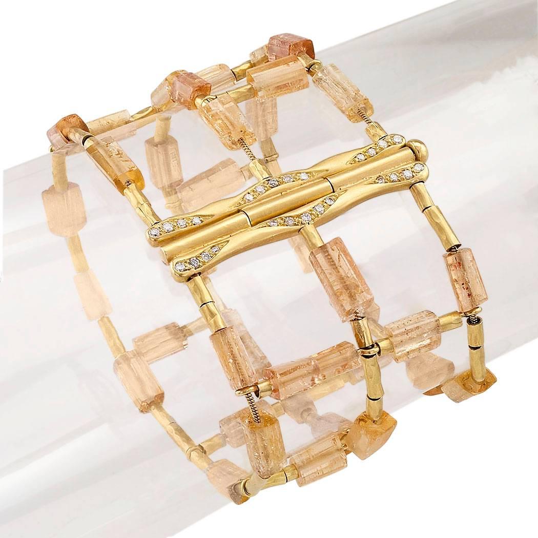 H Stern imperial topaz diamond and gold link bracelet. The ladder-inspired design features baton-shaped, melon-color, imperial topaz beads alternating with tubular gold beads threaded through woven gold wire, completed by a complimentary gold clasp