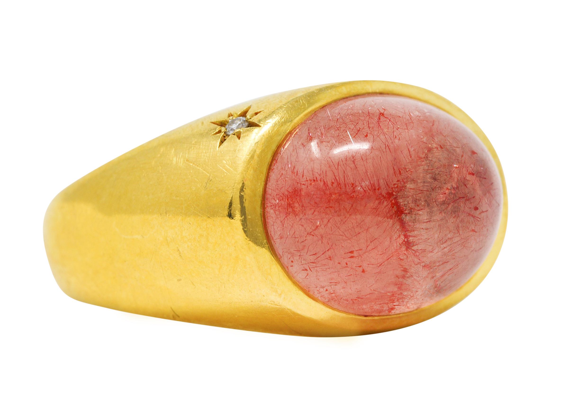 Bombè band ring centers an oval rutilated quartz cabochon - measuring 14.0 x 11.0 mm

Translucent light pink in body color and semi-transparent with rutile inclusions

Rutile exhibits moderate to strong aventurescence

Set East to West in a polished