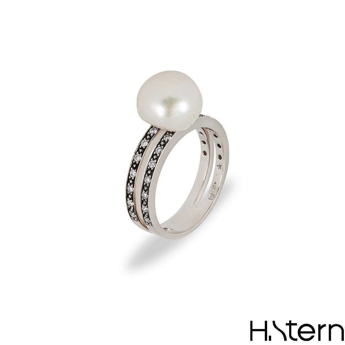A unique 18k Noble gold ring by H. Stern from the Pearl collection. The ring features a white pearl set to the top of a split shank band that is composed of a mixture of yellow and white gold. Further complementing the pearl are 28 round brilliant
