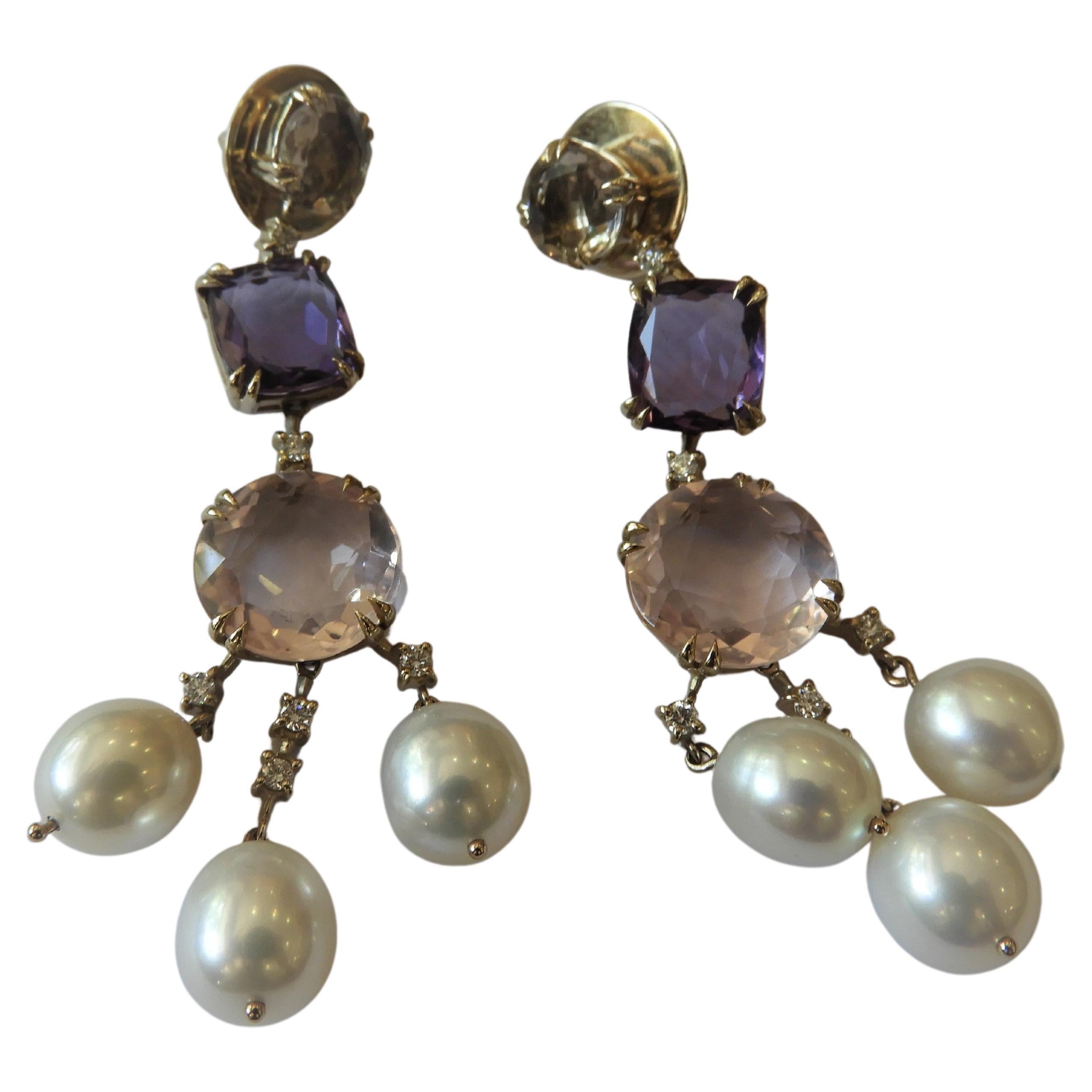 Stunning pair chandelier Primavera Earrings from reknown Brazilian jeweller H. Stern's 'Primavera' collection.
Surmount is an 8.0 mm mixed round cut champagne quartz - transparent with light brownish yellow color. 
Cushion cut amethysts measuring