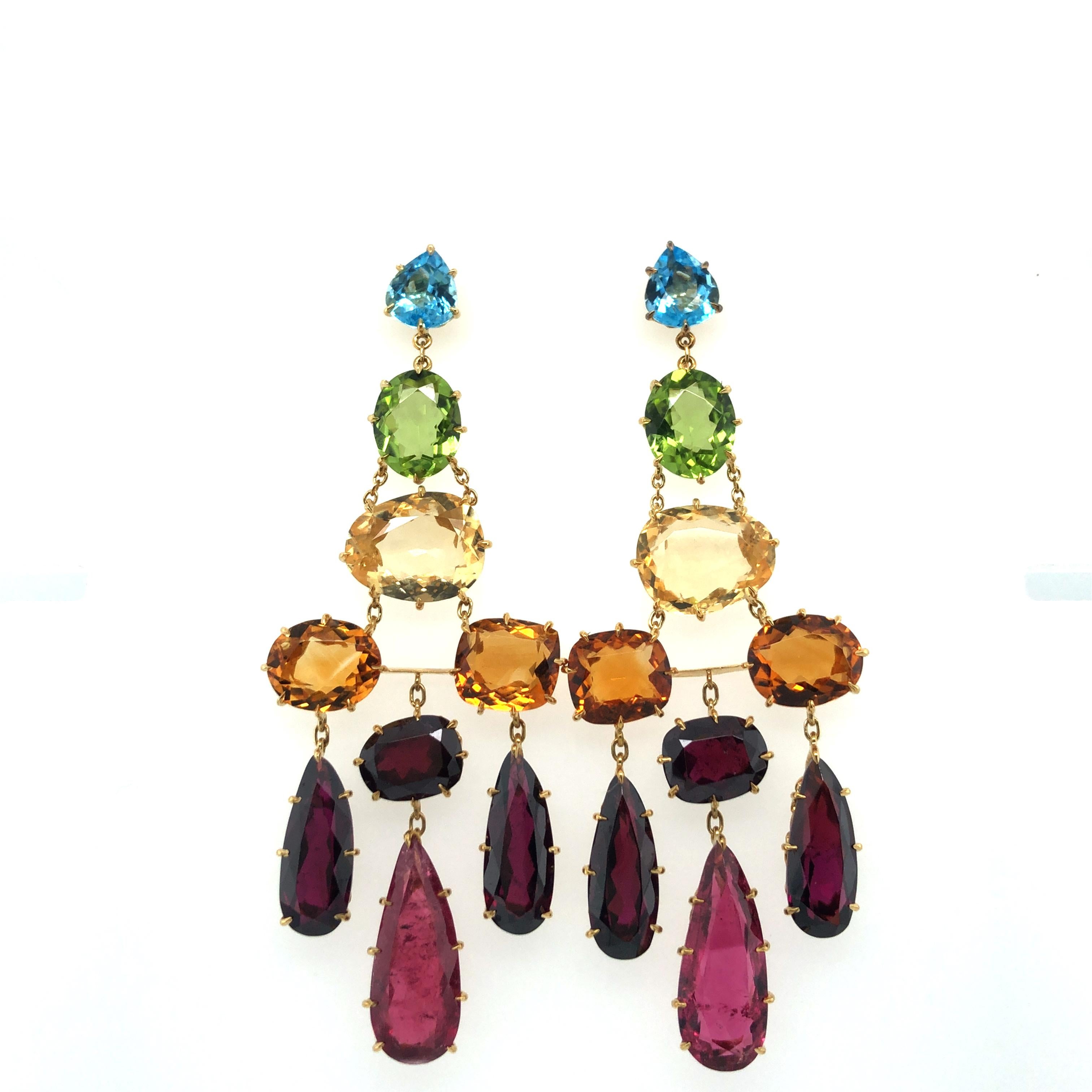 Stunning pair of earstuds from reknown Brazilian jeweller H. Stern's 'Primavera' collection.

These bold and colourful earstuds in 18 karat yellow gold are prong-set with 18 coloured gemstones in varying sizes and shapes: 6 cushion-shaped citrines