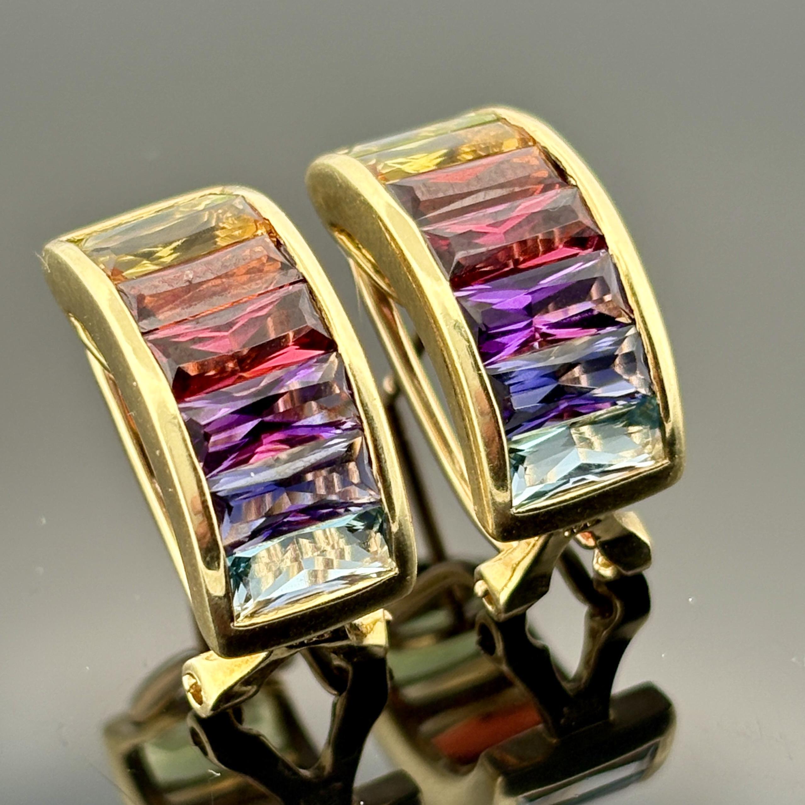 Maker: H. Stern
Collection: Rainbow
Metal: 18K yellow gold
Gemstones: Channel-set French-cut baguette semi-precious gemstones including peridot, citrine, garnet, amethyst, iolite, and blue topaz
Weight: 8.8 grams
Measurements: 18.8mm long × 8.8mm