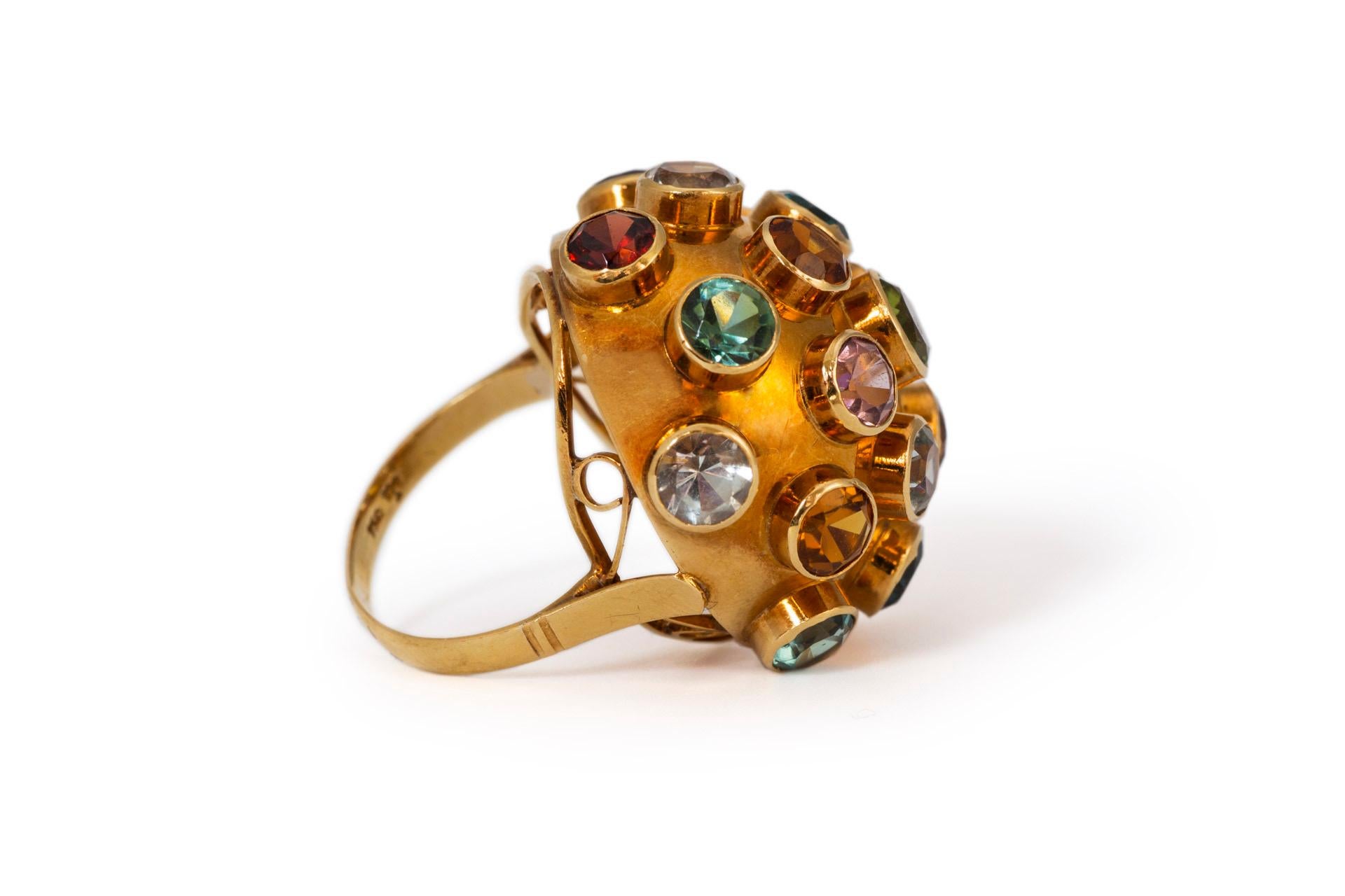 Large sized iconic H Stern Sputnik ring from Brazil featuring multi gems including peridot, amethyst, citrine, green tourmaline, aquamarine, garnet and blue sapphire. Designed in the mid 1950’s to showcase the multitude of Brazilian mined gemstones.