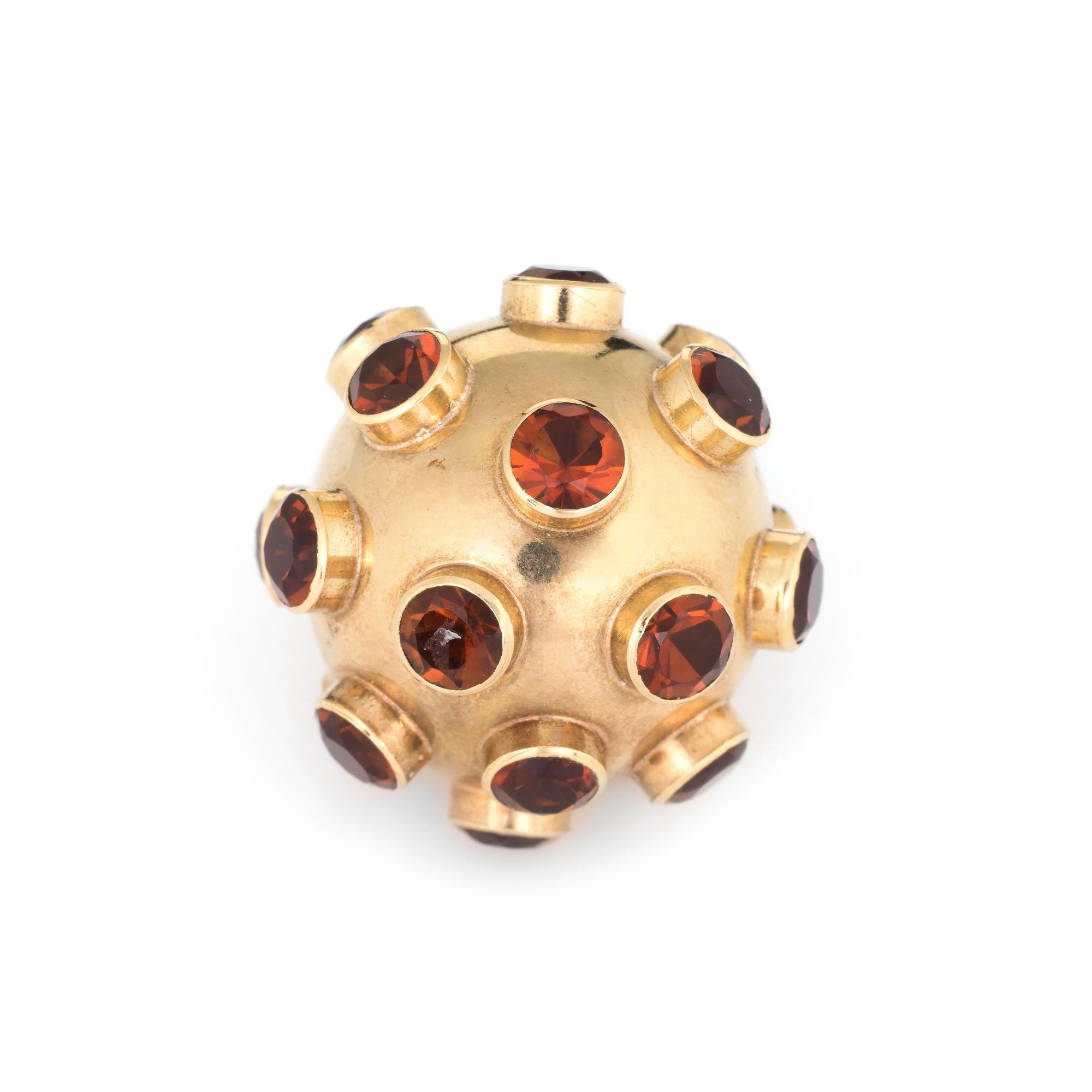 Ornate H Stern sputnik garnet pendant (circa 1950s to 1960s), crafted in 18 karat yellow gold. 

Garnets are uniform in size with each measuring 4mm. The total estimated weight is 6 carats. The garnets are in excellent condition and free of cracks