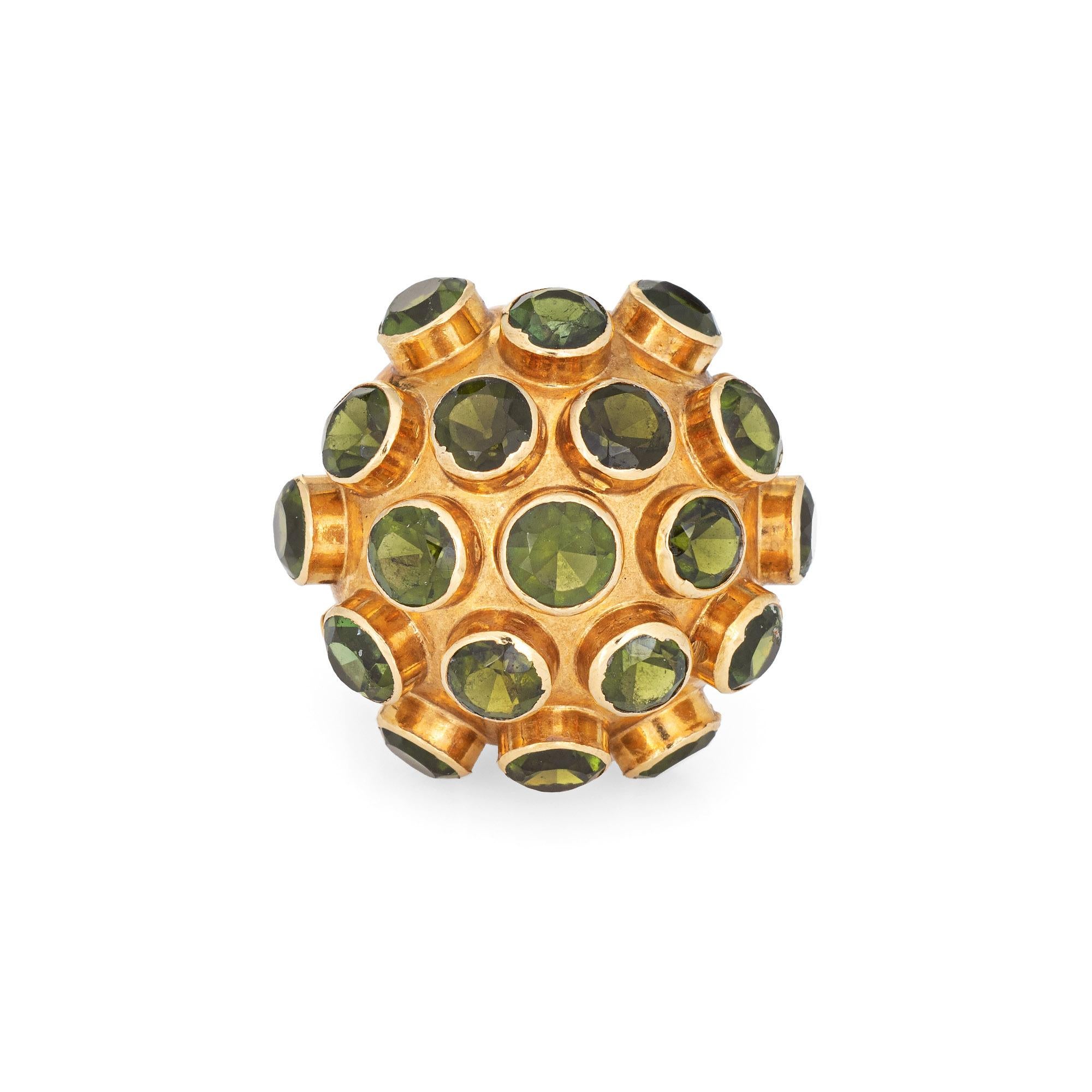 Ornate H Stern sputnik domed peridot cocktail ring (circa 1950s to 1960s), crafted in 18 karat yellow gold. 

Peridot totals an estimated 4.75 carats (few light surface abrasions visible under a 10x loupe).

The dome measures 22mm diameter (0.86