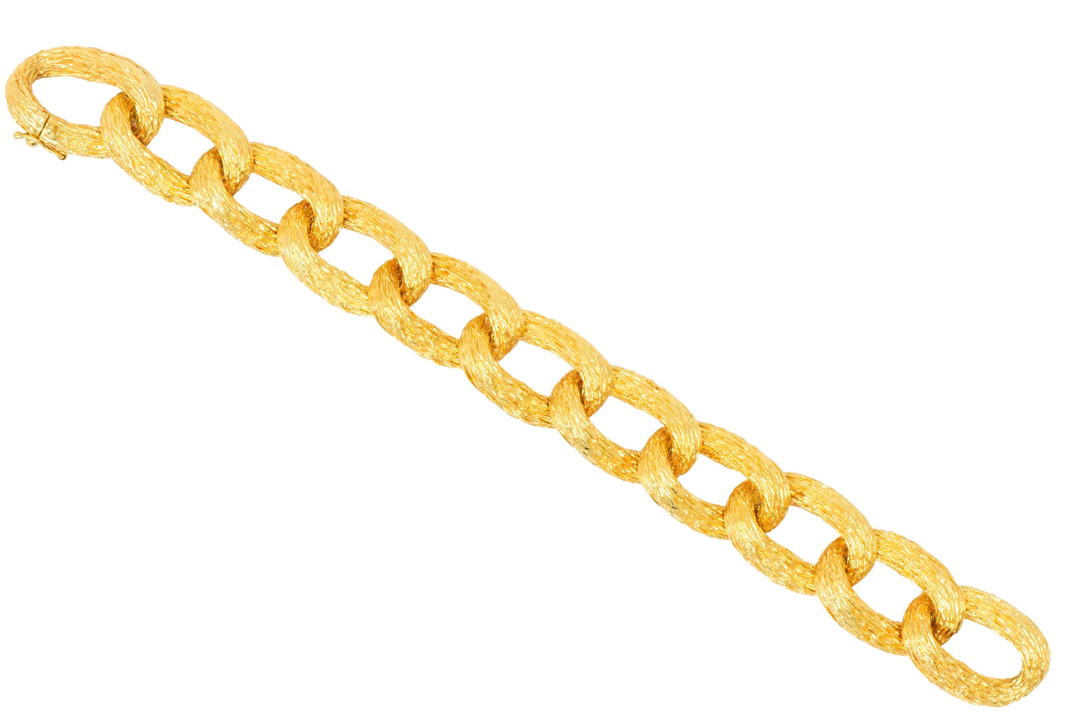 Large textured gold curb style links

Completed by a concealed clasp with figure-eight safety

Maker's mark for H. Stern

Circa 1970's

Length: 8 1/4 Inches

Width: 3/4 Inch

Total Weight: 78.4 Grams

Chic. Bold. Stylish.      
 

Stock Number: We-